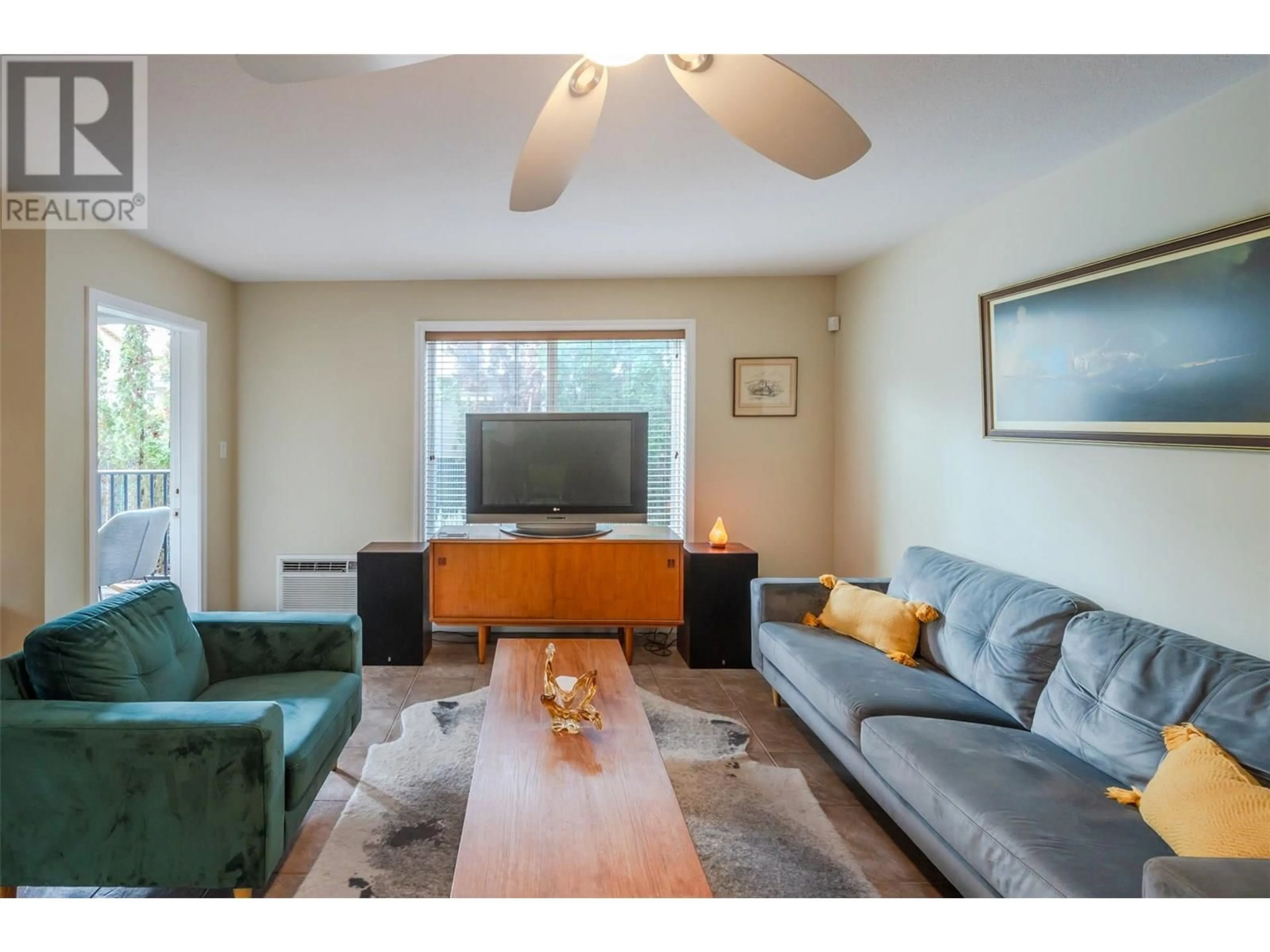 Living room with furniture, wood/laminate floor for 104 - 764 GOVERNMENT STREET, Penticton British Columbia V2A4T3