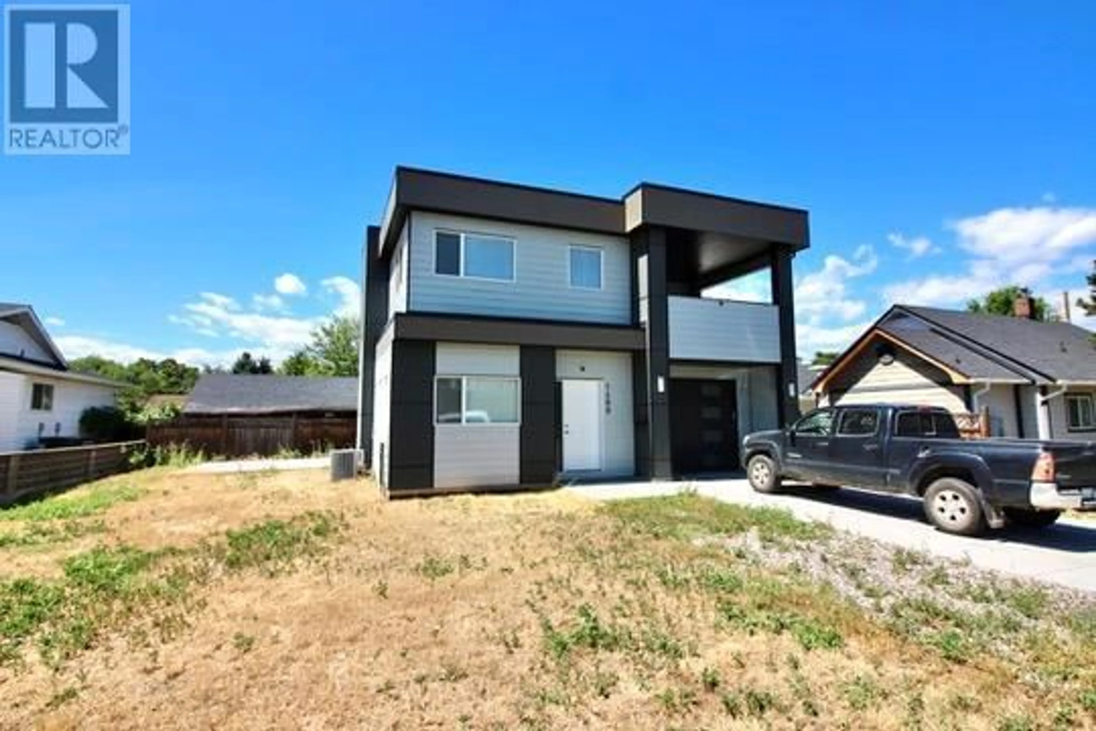 Home with brick exterior material, street for 1480 INKAR ROAD, Kelowna British Columbia V1Y5W1