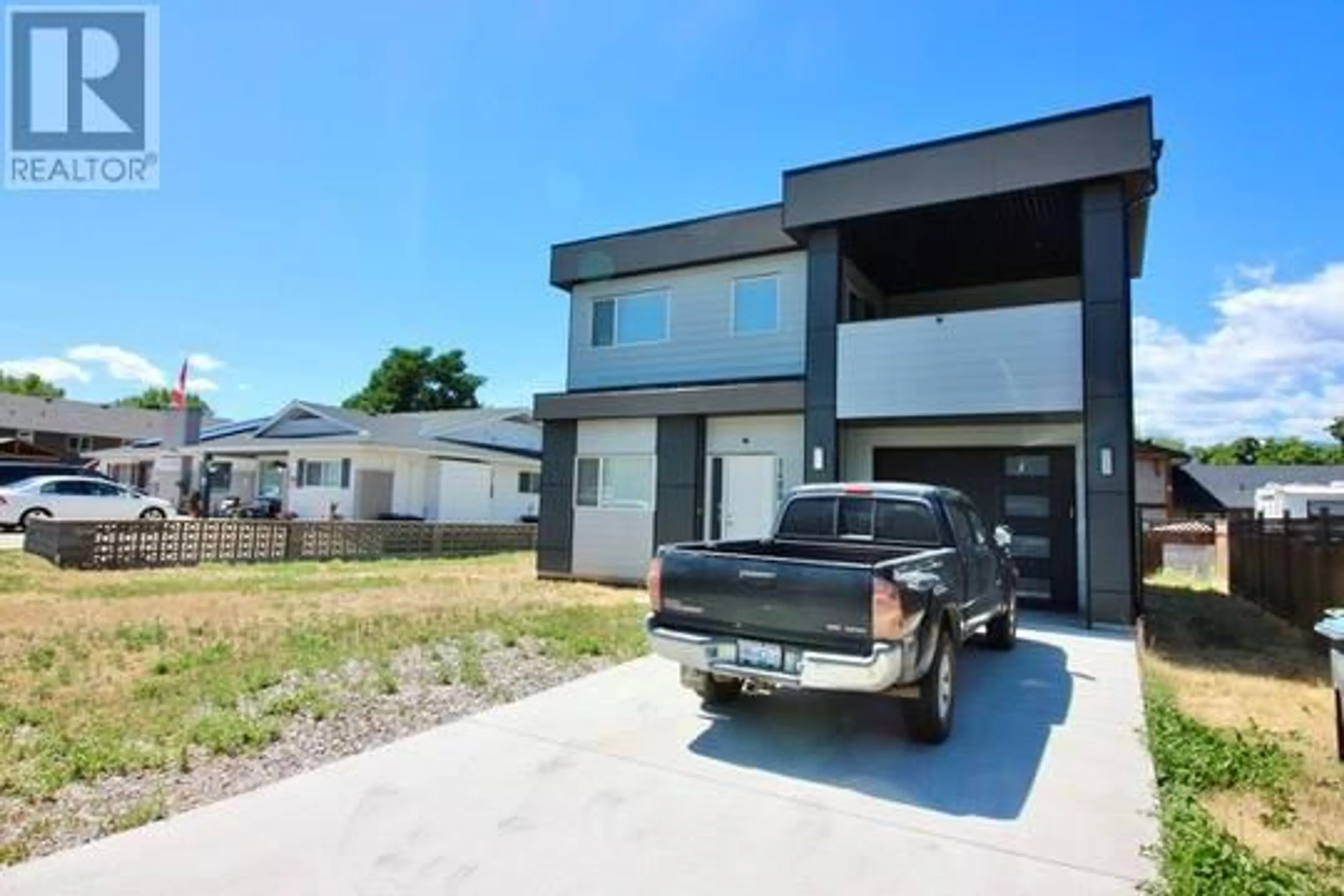 A pic from outside/outdoor area/front of a property/back of a property/a pic from drone, street for 1480 INKAR ROAD, Kelowna British Columbia V1Y5W1