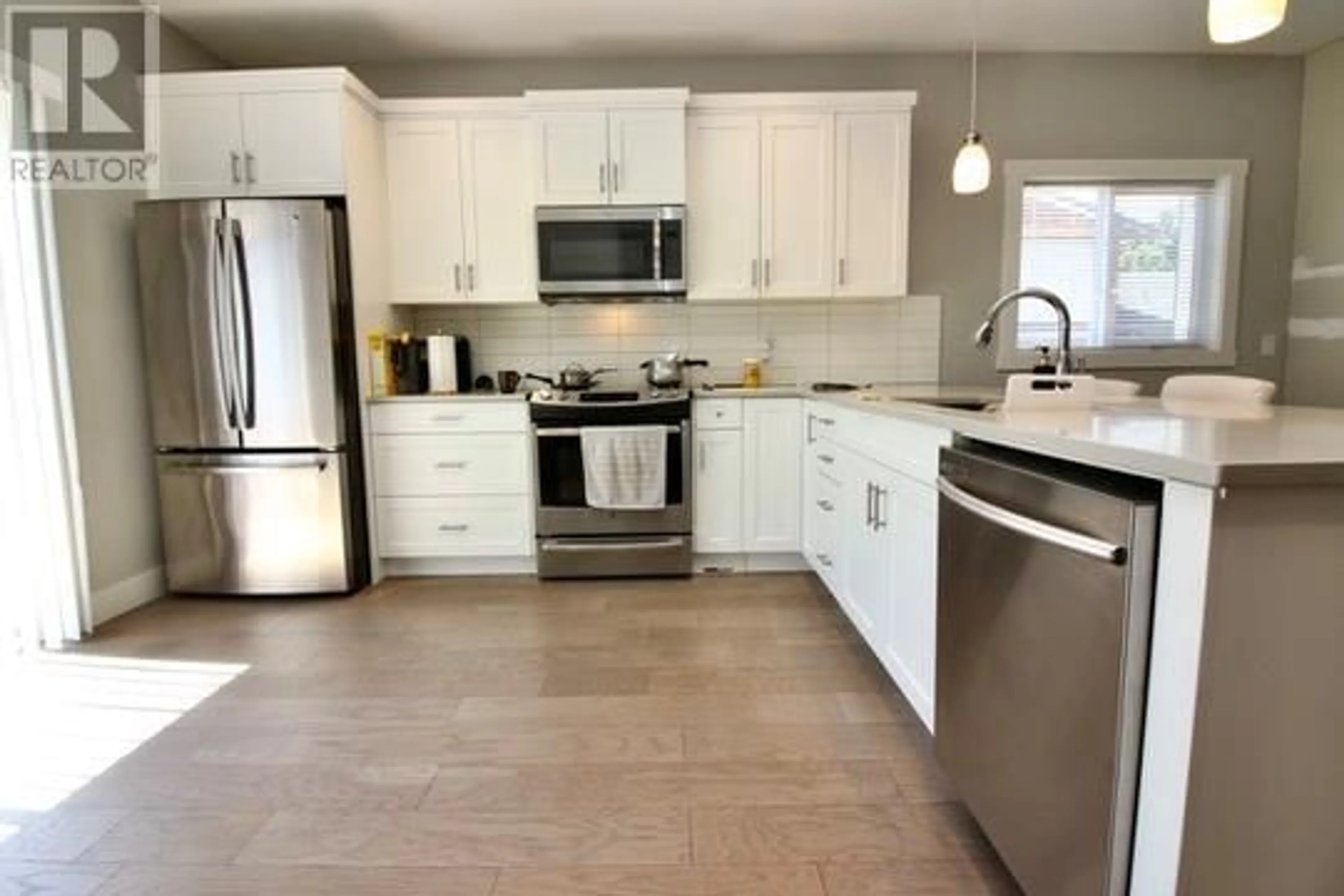 Open concept kitchen, ceramic/tile floor for 1480 INKAR ROAD, Kelowna British Columbia V1Y5W1