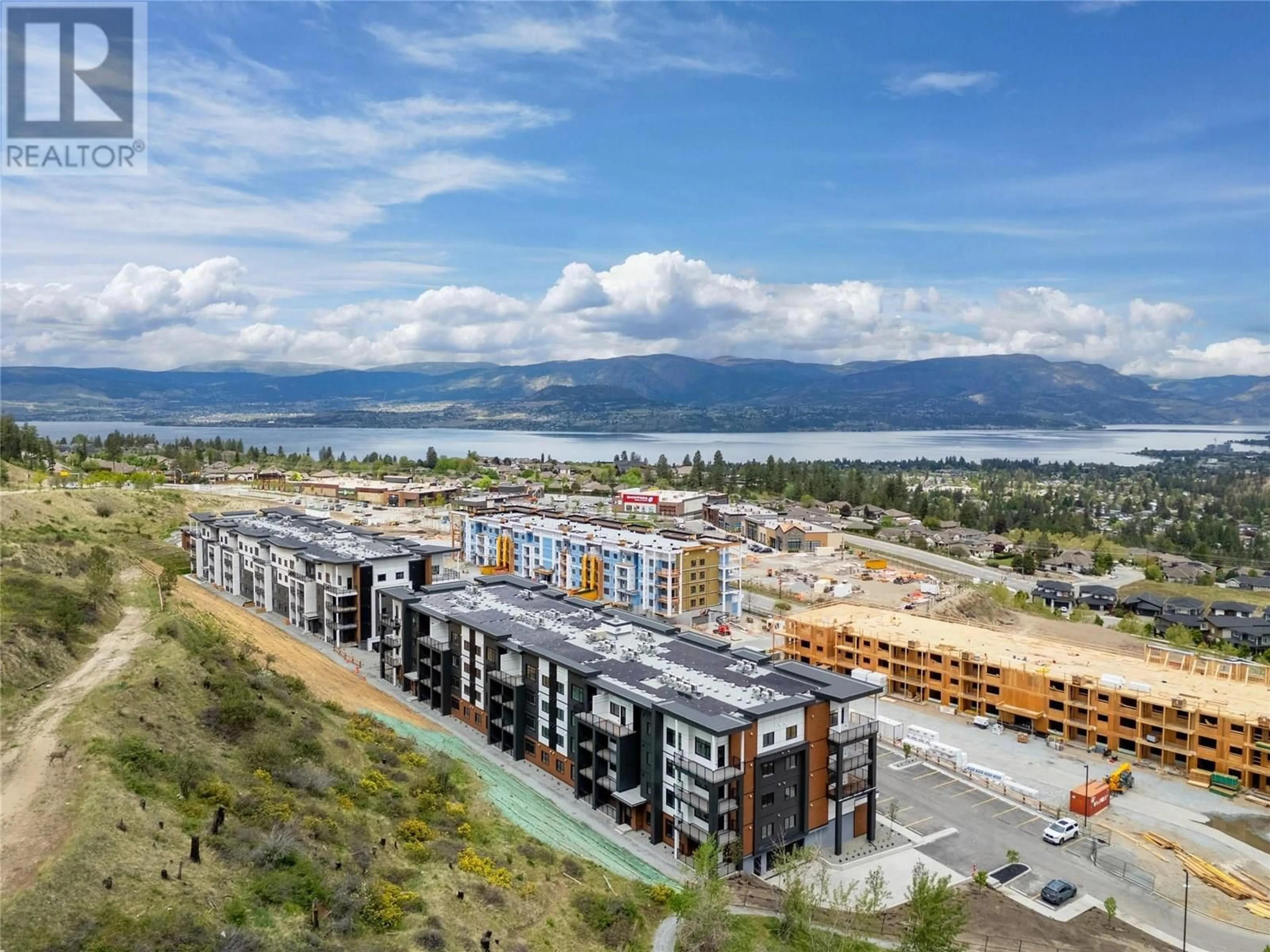 A pic from outside/outdoor area/front of a property/back of a property/a pic from drone, mountain view for 203 - 1057 FROST ROAD, Kelowna British Columbia V1W0G7