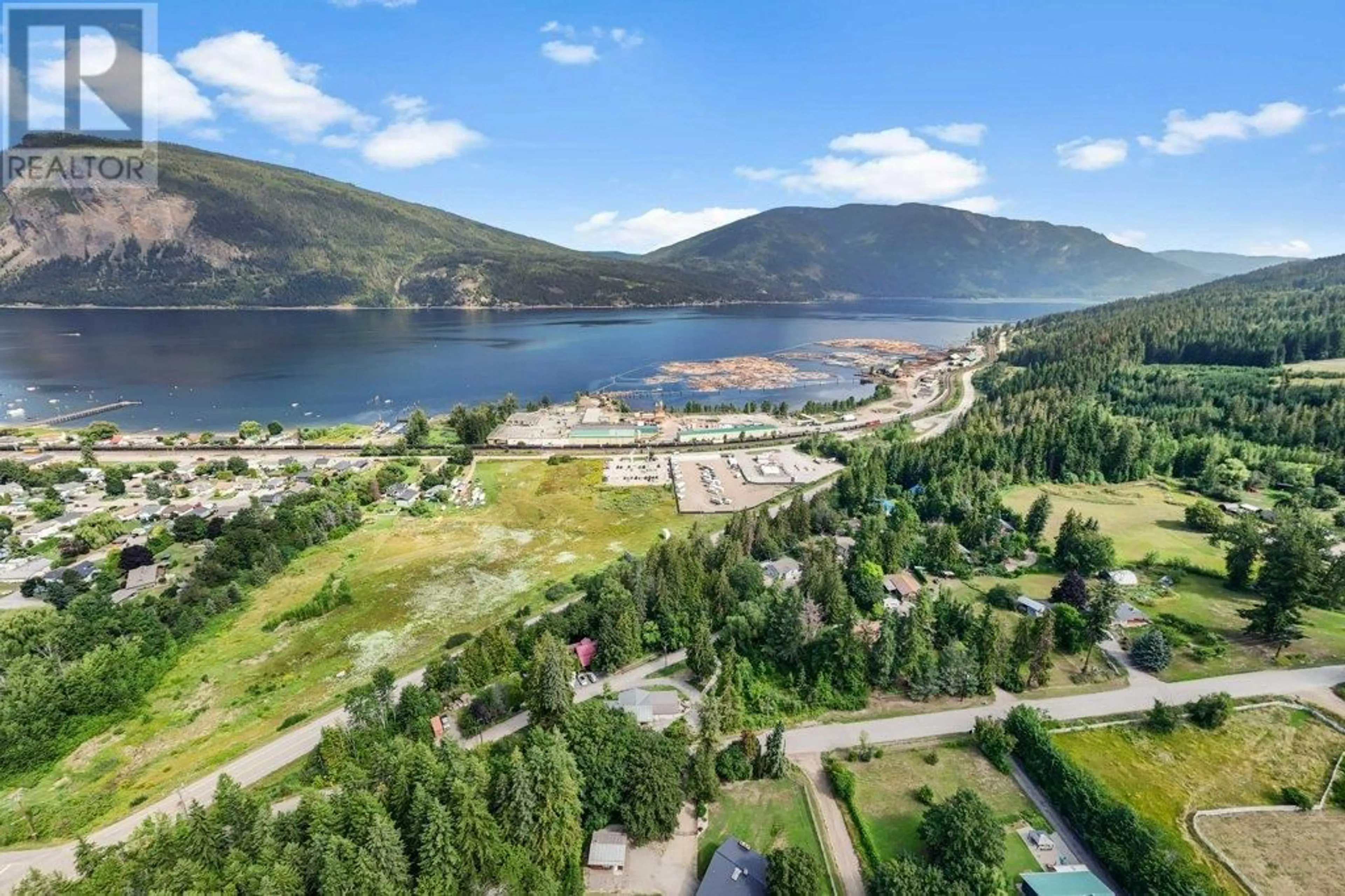 A pic from outside/outdoor area/front of a property/back of a property/a pic from drone, water/lake/river/ocean view for 5790 70 AVENUE, Salmon Arm British Columbia V0E1K0