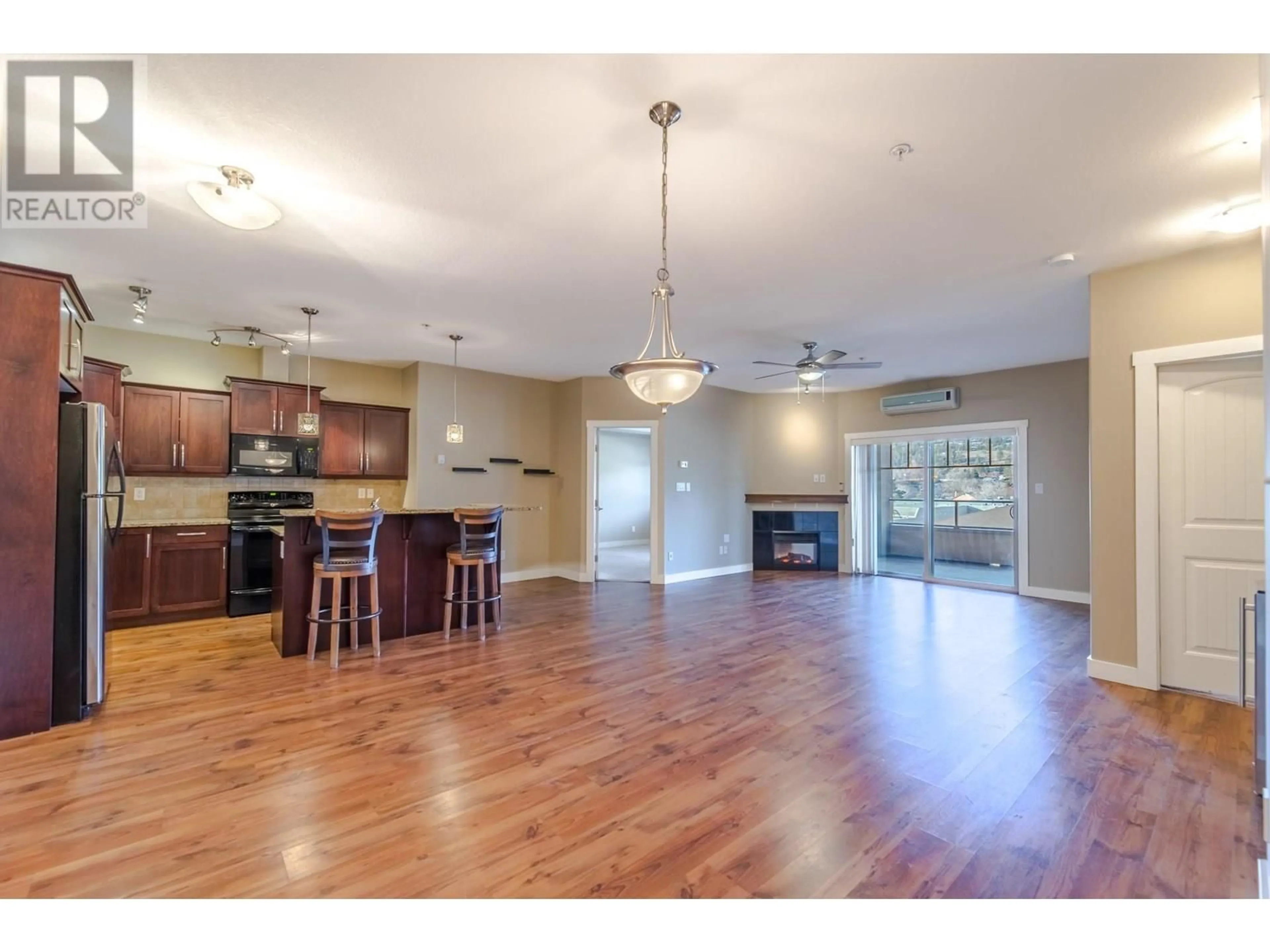 Open concept kitchen, wood/laminate floor for 313 - 13615 VICTORIA ROAD, Summerland British Columbia V0H1Z2