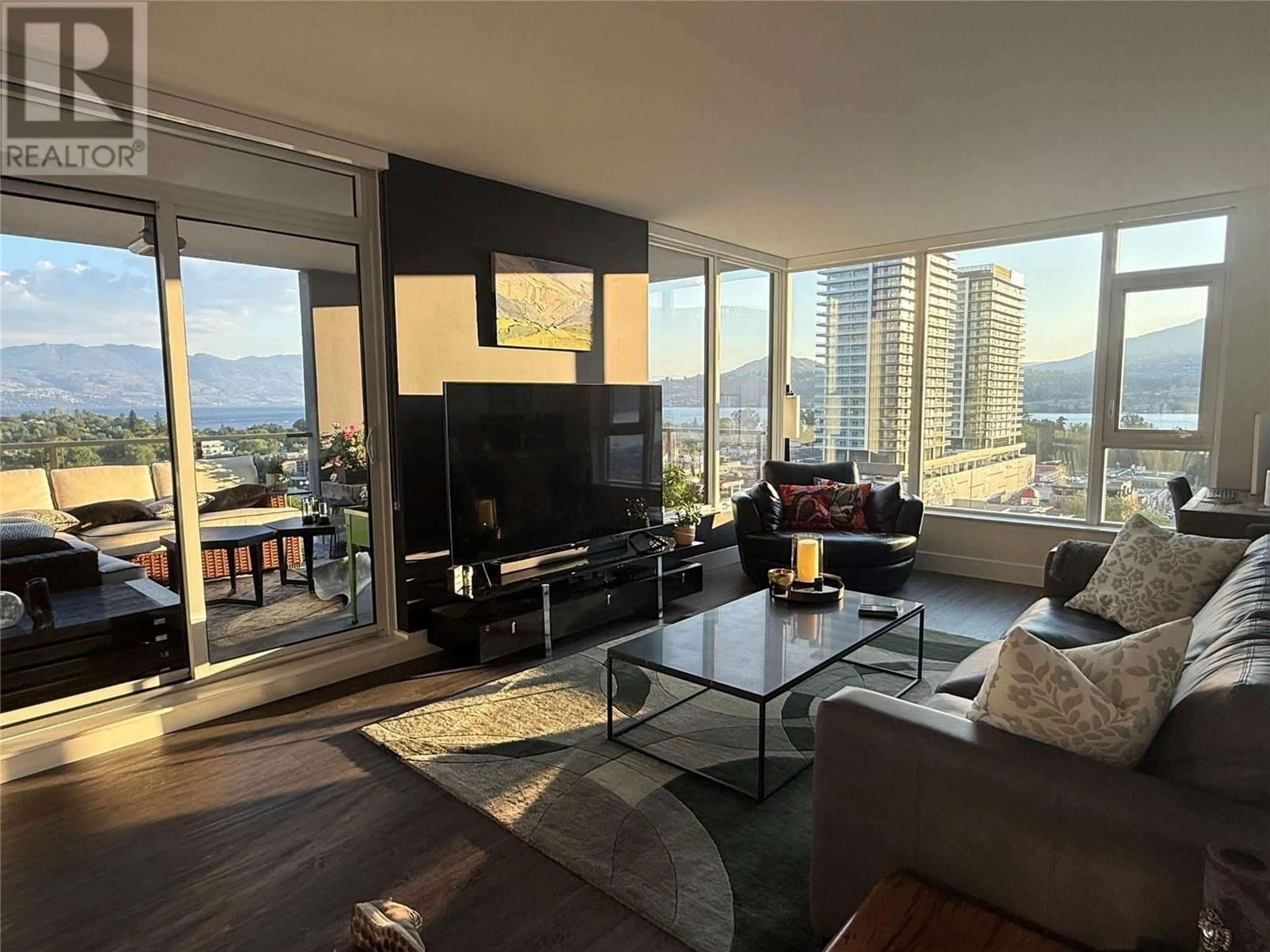 Living room with furniture, wood/laminate floor for 1408 - 1588 ELLIS STREET, Kelowna British Columbia V1Y0H1