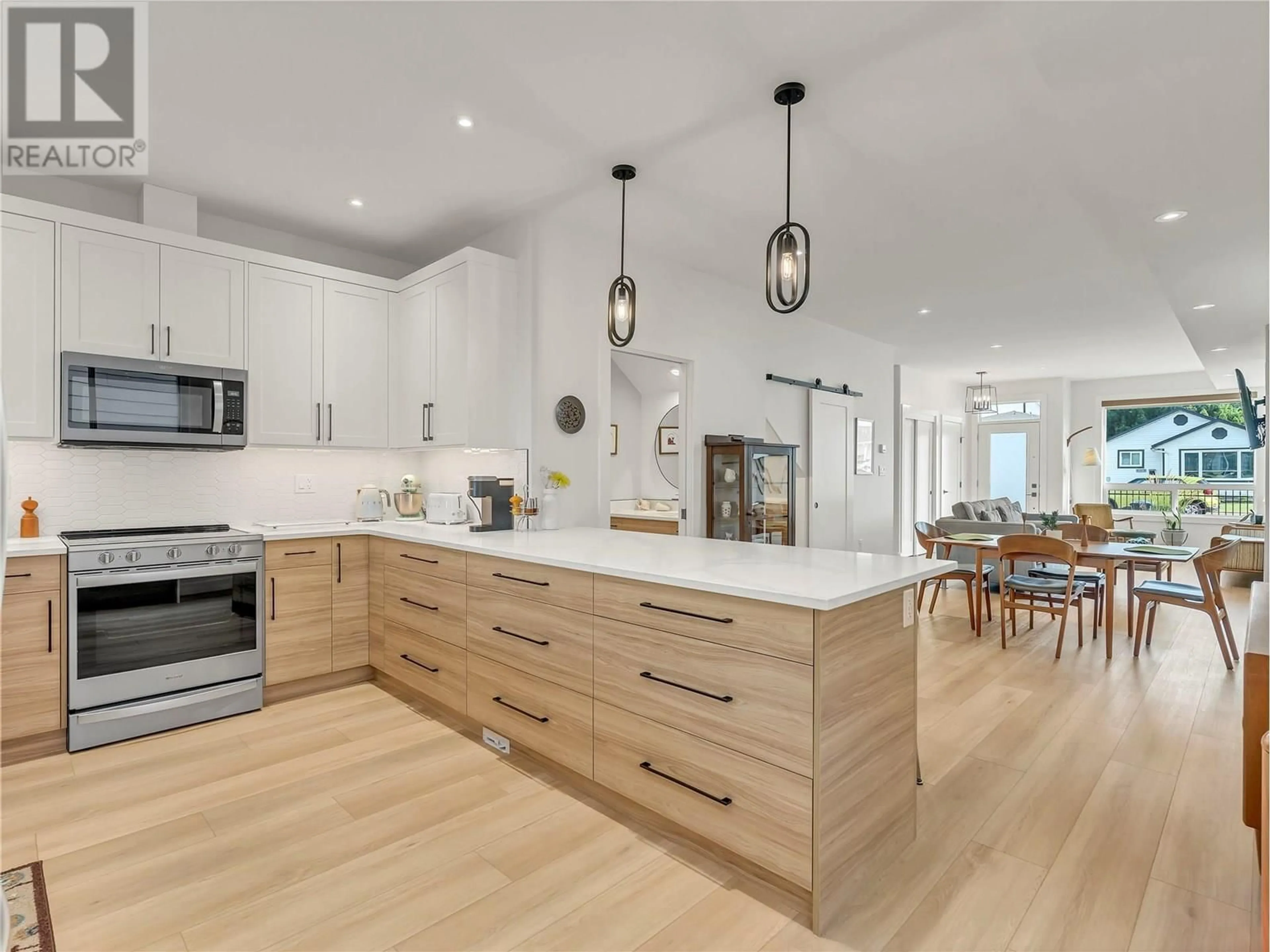 Open concept kitchen, wood/laminate floor for 101 - 360 DOUGLAS AVENUE, Penticton British Columbia V2A2V2