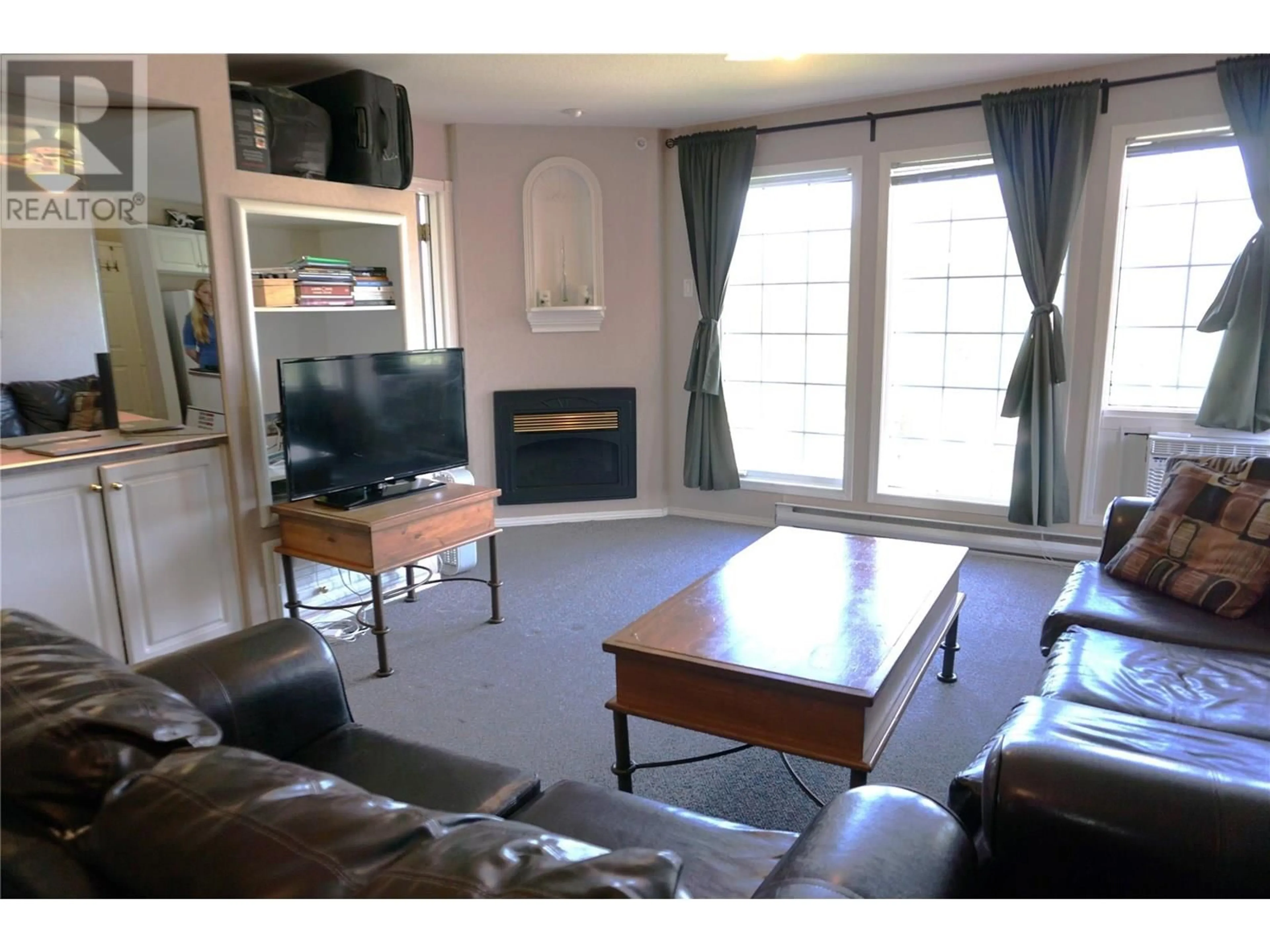 Living room with furniture, wood/laminate floor for 5014A - 5052 RIVERVIEW ROAD, Fairmont Hot Springs British Columbia V0B1L1