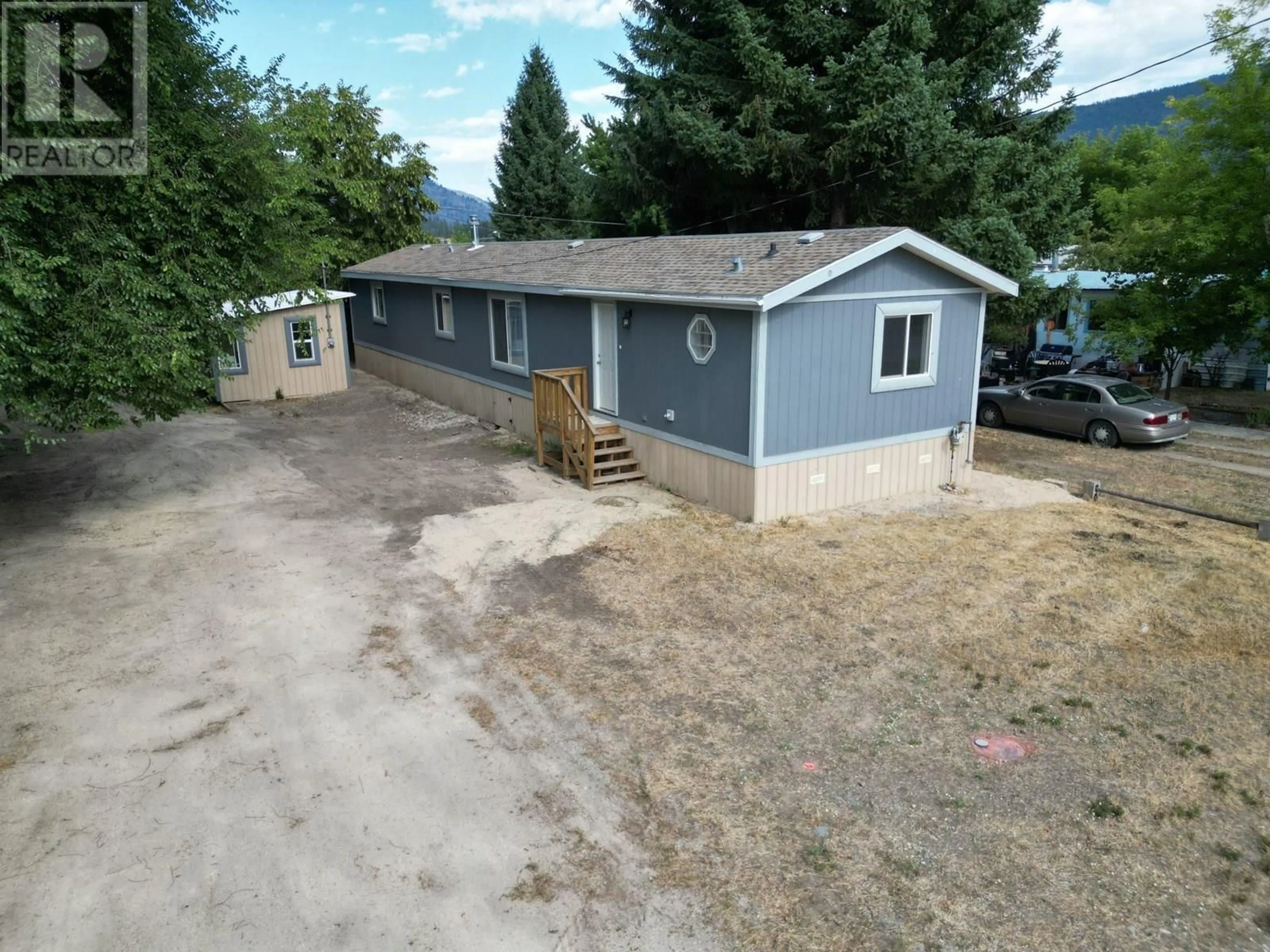 A pic from outside/outdoor area/front of a property/back of a property/a pic from drone, mountain view for 6450 7TH STREET, Grand Forks British Columbia V0H1H4