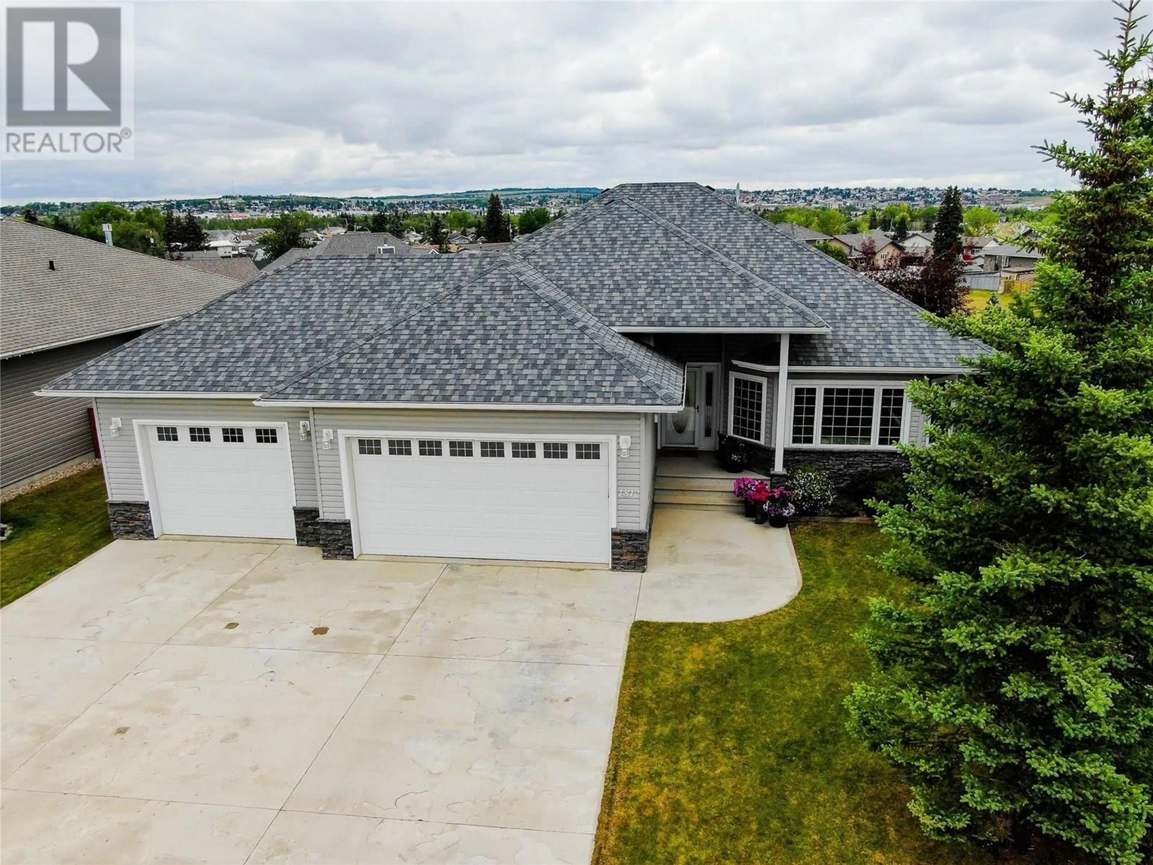 A pic from outside/outdoor area/front of a property/back of a property/a pic from drone, street for 1812 110 AVENUE, Dawson Creek British Columbia V1G0A3