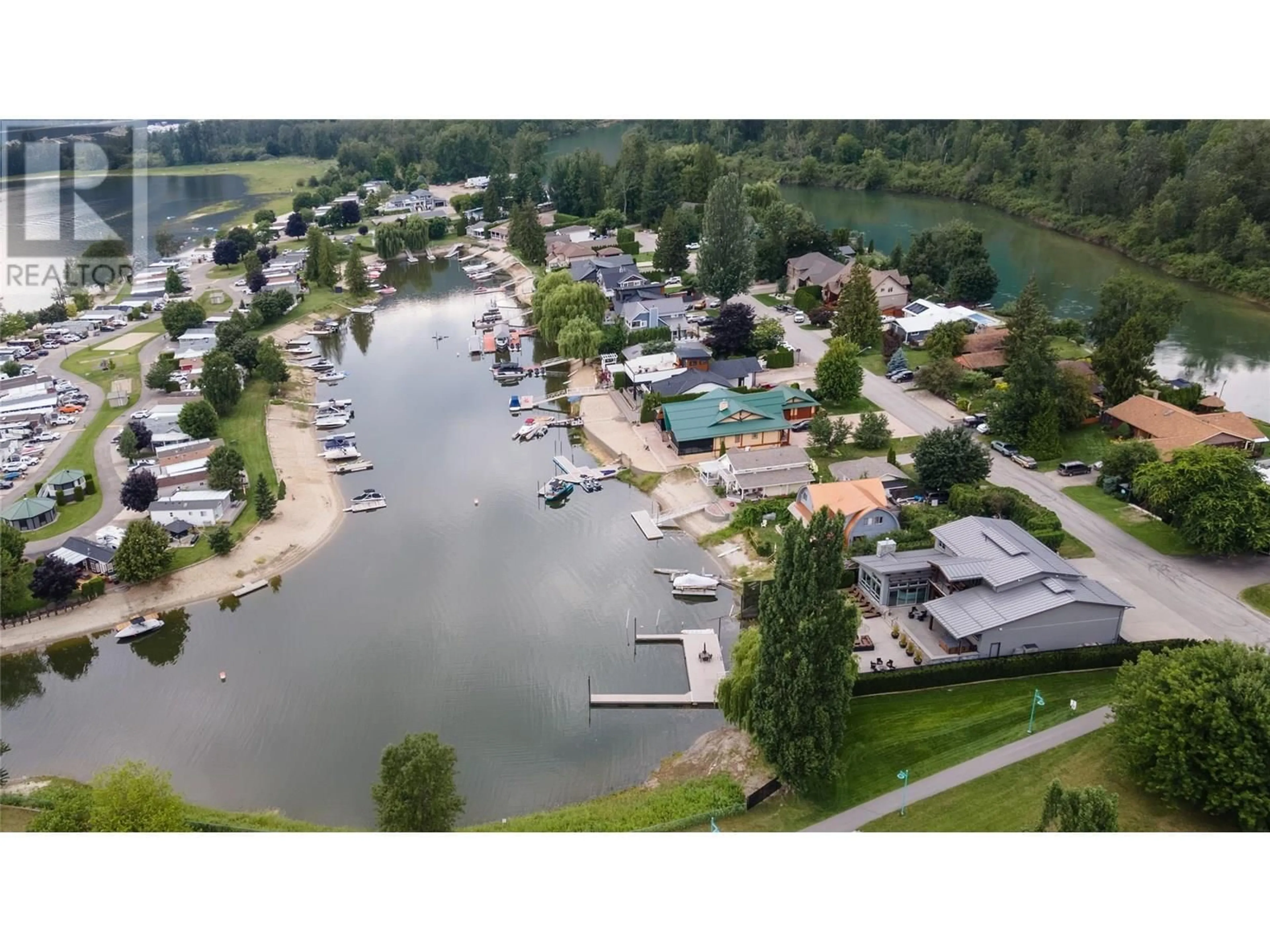 A pic from outside/outdoor area/front of a property/back of a property/a pic from drone, water/lake/river/ocean view for 1420 SILVER SANDS ROAD, Sicamous British Columbia V0E2V4