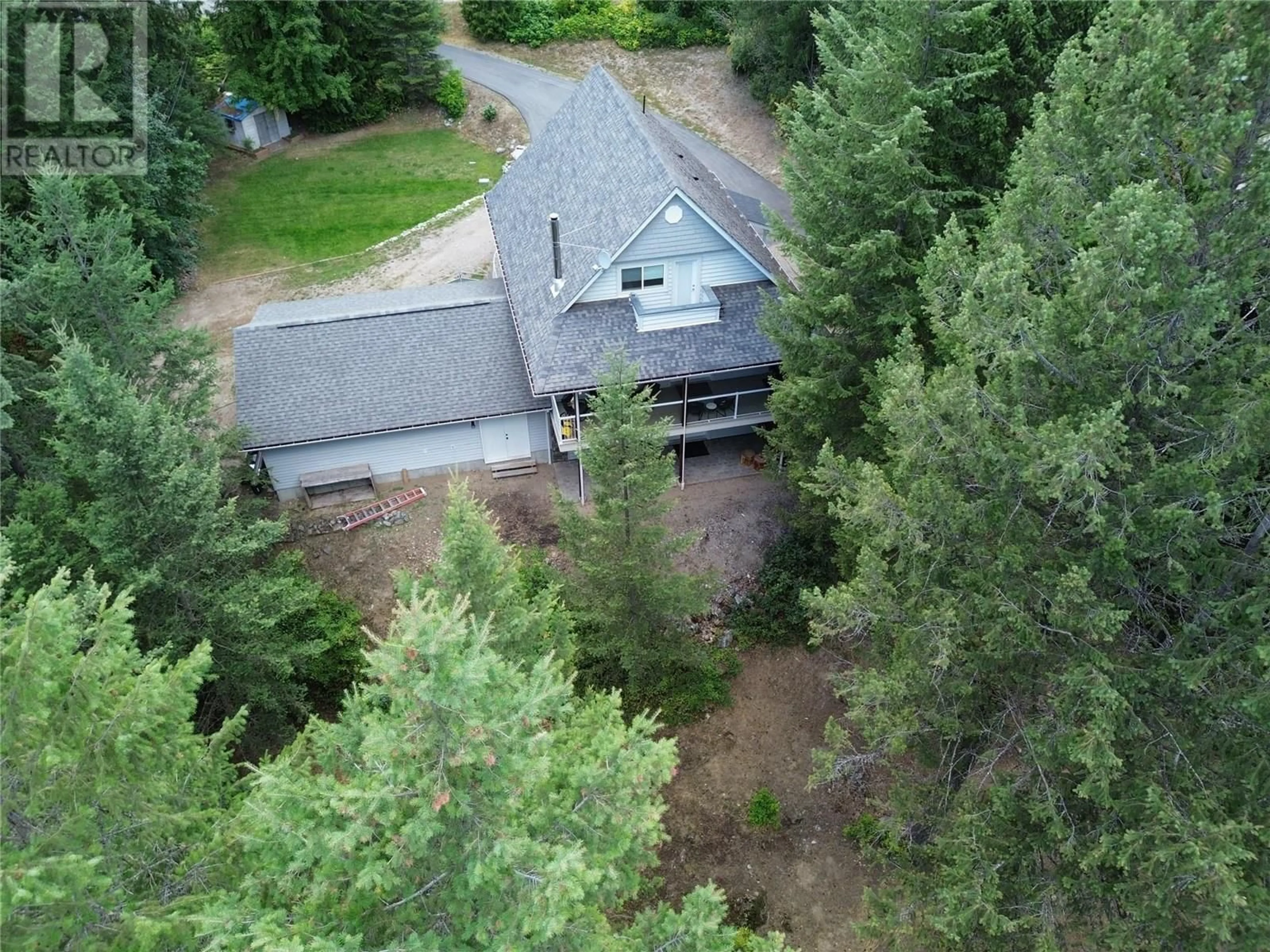 A pic from outside/outdoor area/front of a property/back of a property/a pic from drone, forest/trees view for 157 CHASE ROAD, Christina Lake British Columbia V0H1E0