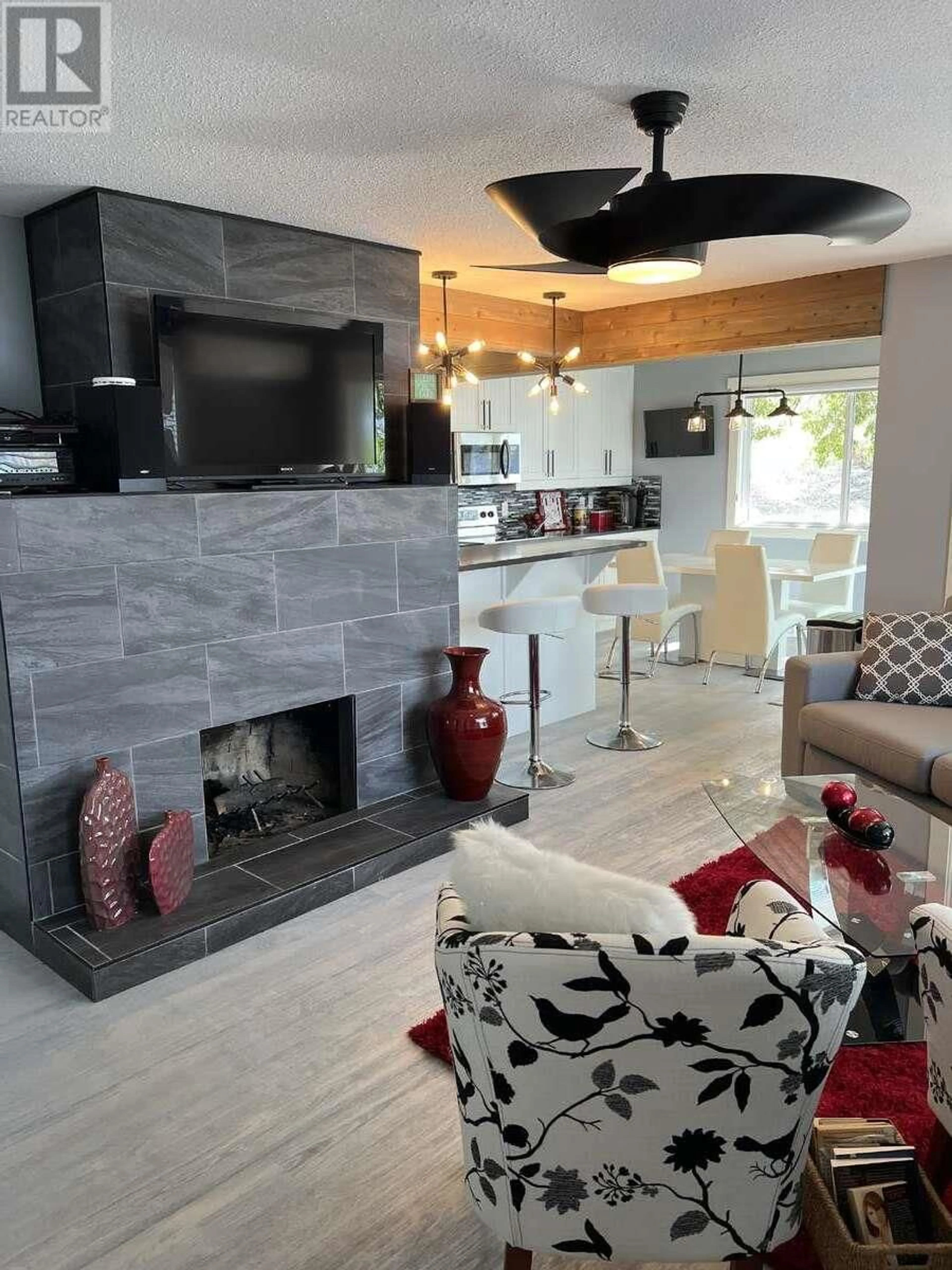 Living room with furniture, ceramic/tile floor for 3902 FINCH ROAD, Kelowna British Columbia V4V1N4