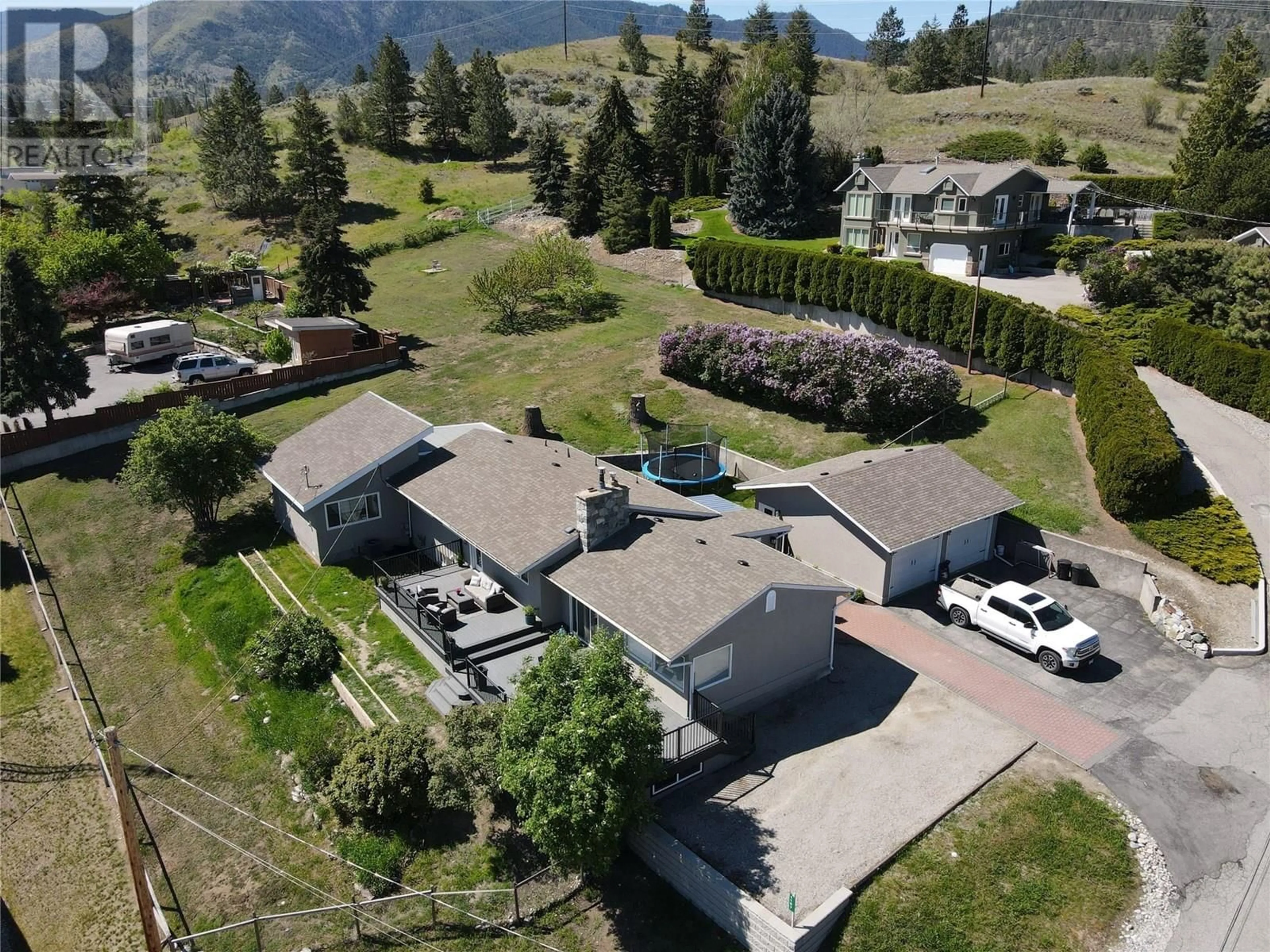 A pic from outside/outdoor area/front of a property/back of a property/a pic from drone, mountain view for 1107 PARK PLACE, Penticton British Columbia V2A8X9