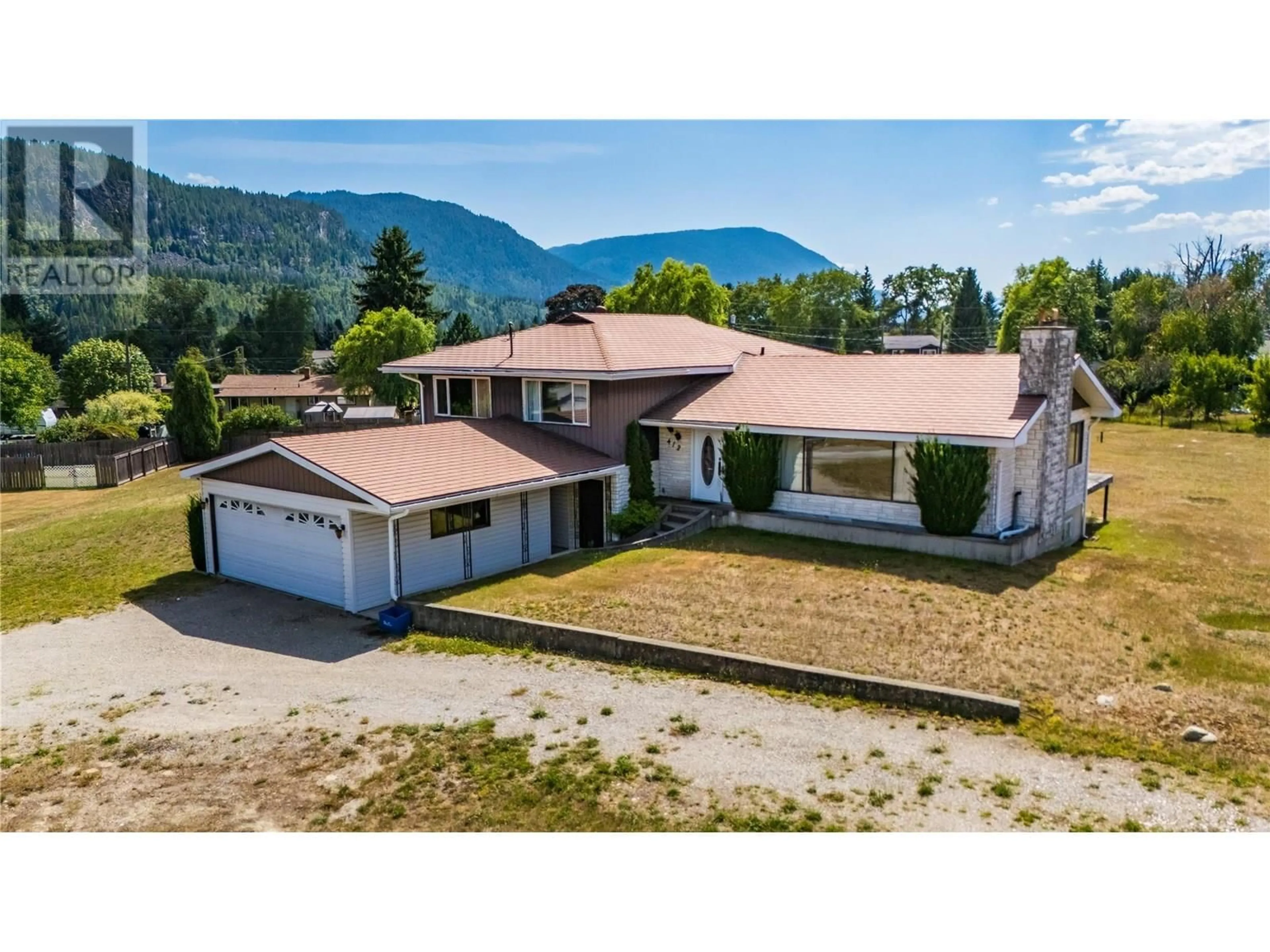 A pic from outside/outdoor area/front of a property/back of a property/a pic from drone, mountain view for 412 104TH STREET, Castlegar British Columbia V1N3G5