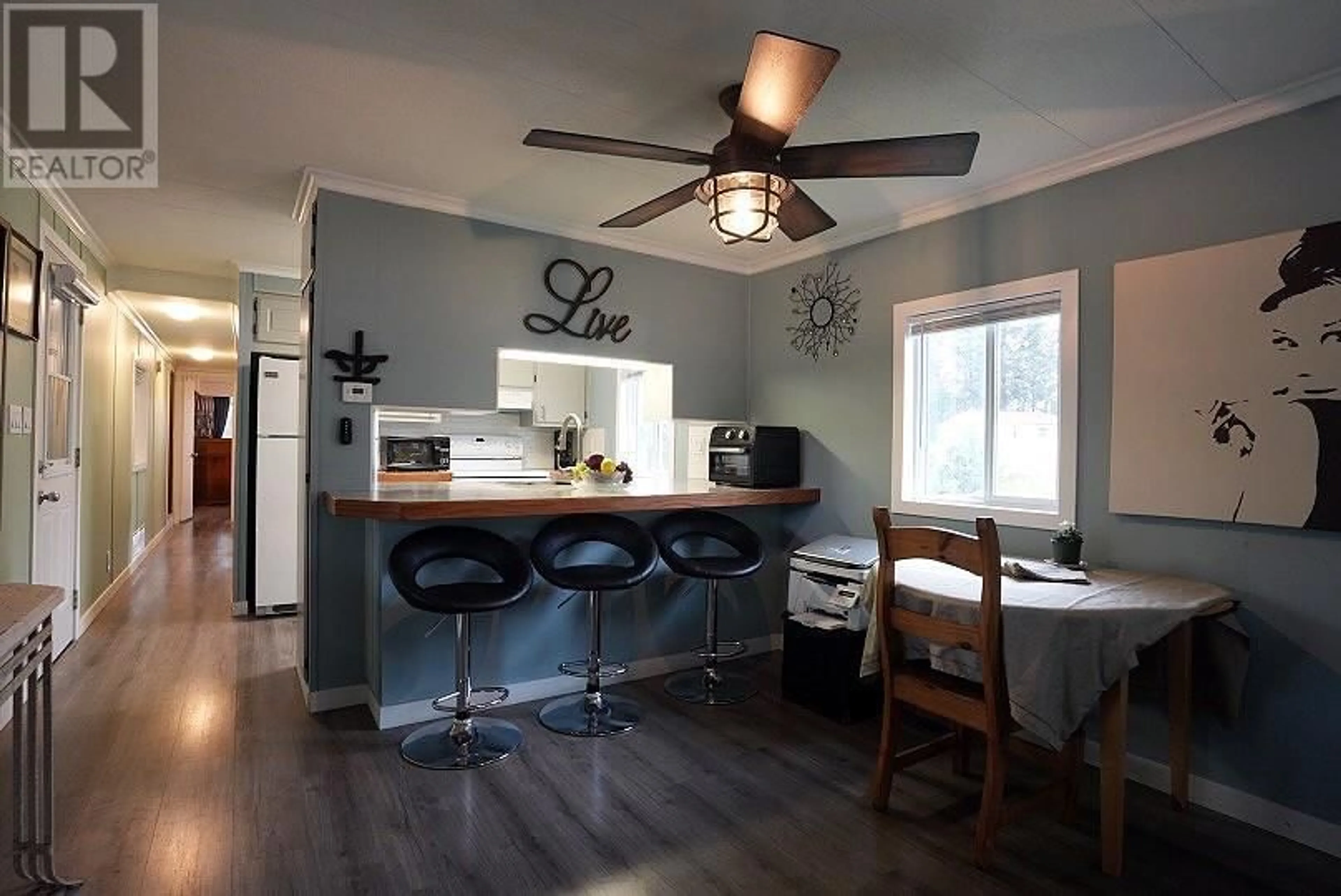Open concept kitchen, wood/laminate floor for 102 JASPER DRIVE, Logan Lake British Columbia V0K1W0