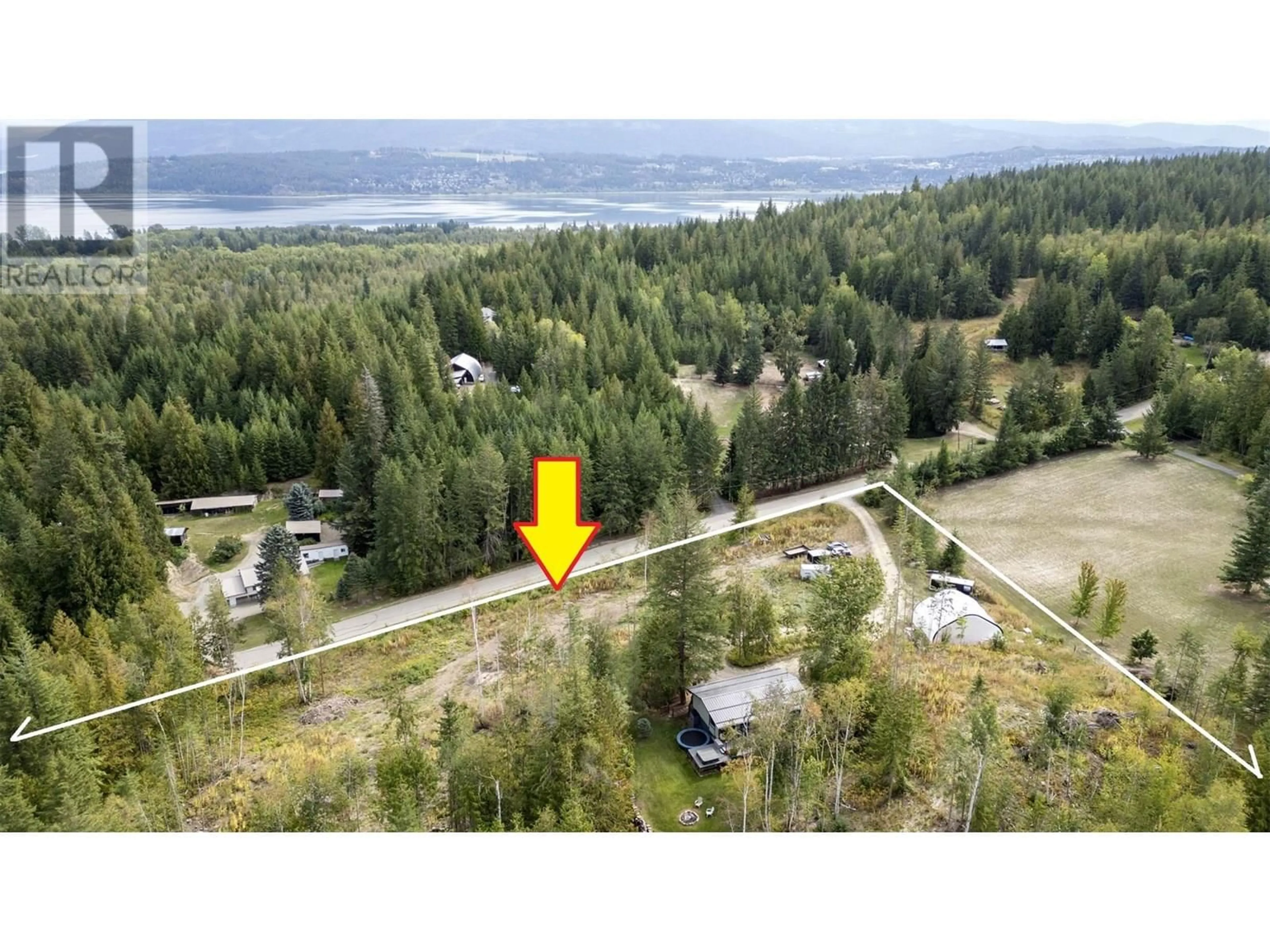 A pic from outside/outdoor area/front of a property/back of a property/a pic from drone, water/lake/river/ocean view for 4451 42 STREET NORTHWEST, Salmon Arm British Columbia V1E3A7