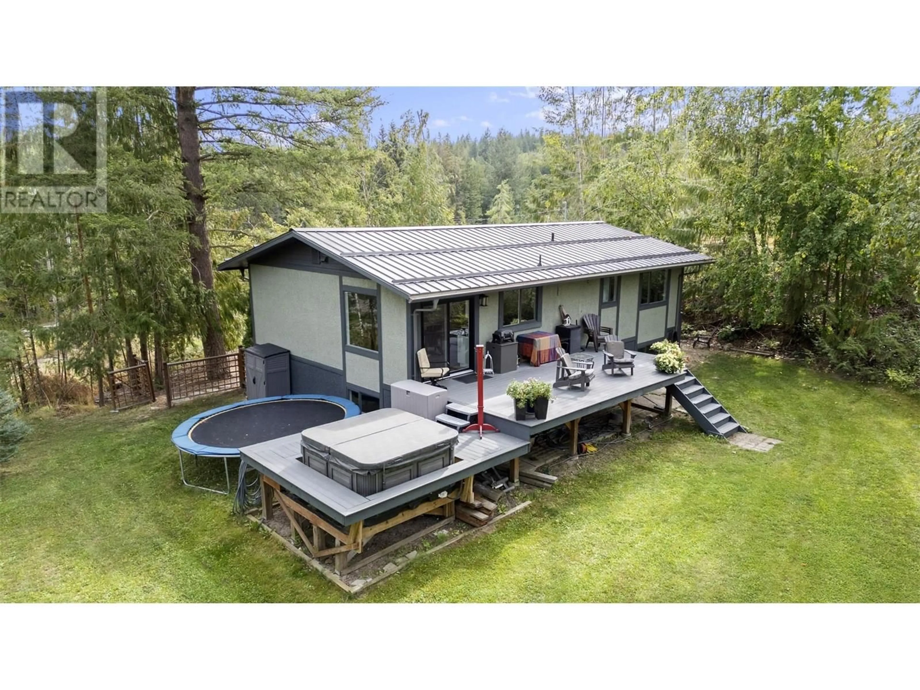A pic from outside/outdoor area/front of a property/back of a property/a pic from drone, water/lake/river/ocean view for 4451 42 STREET NORTHWEST, Salmon Arm British Columbia V1E3A7