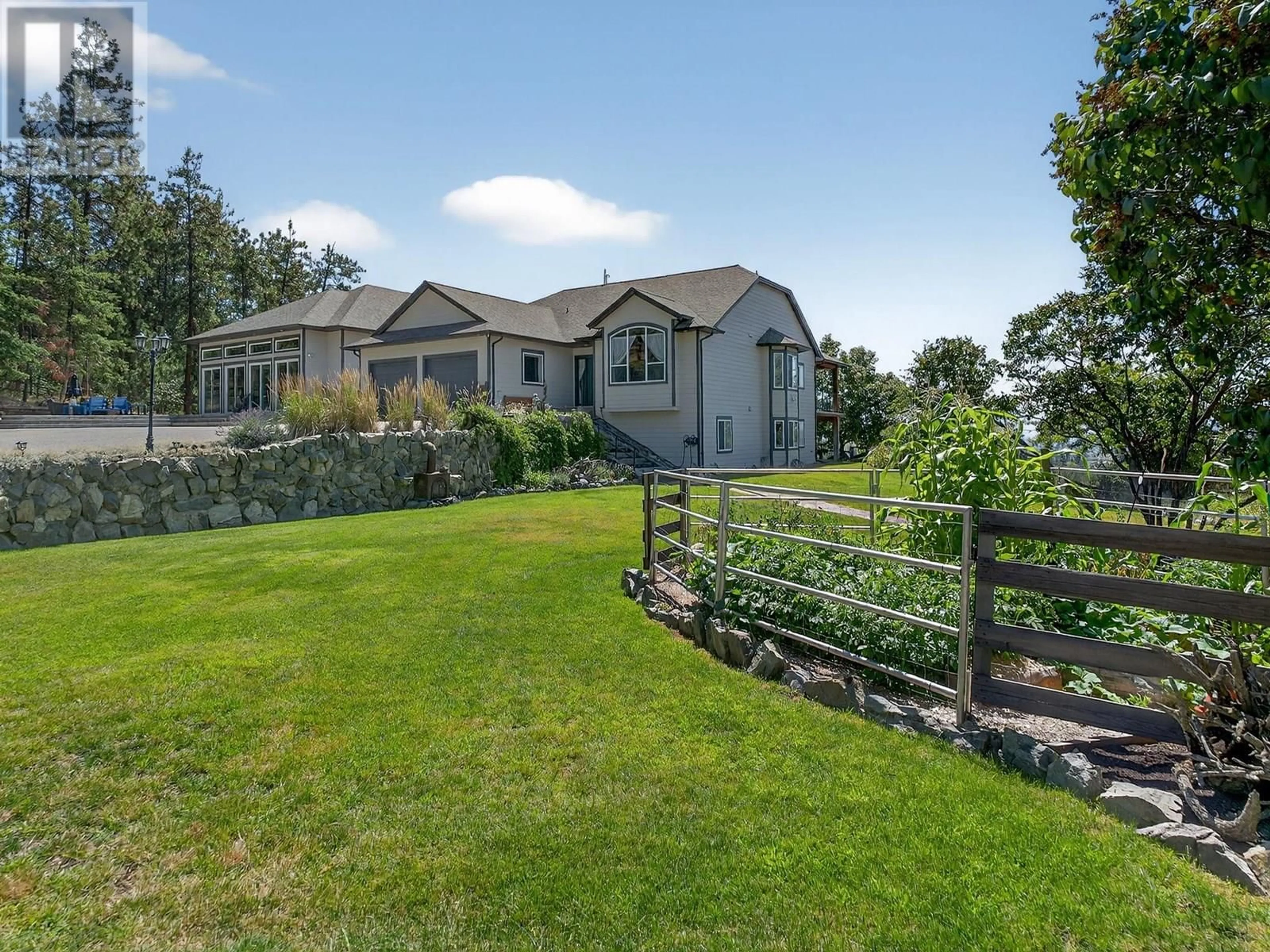A pic from outside/outdoor area/front of a property/back of a property/a pic from drone, water/lake/river/ocean view for 5955 POSTILL LAKE ROAD, Kelowna British Columbia V1X7V3