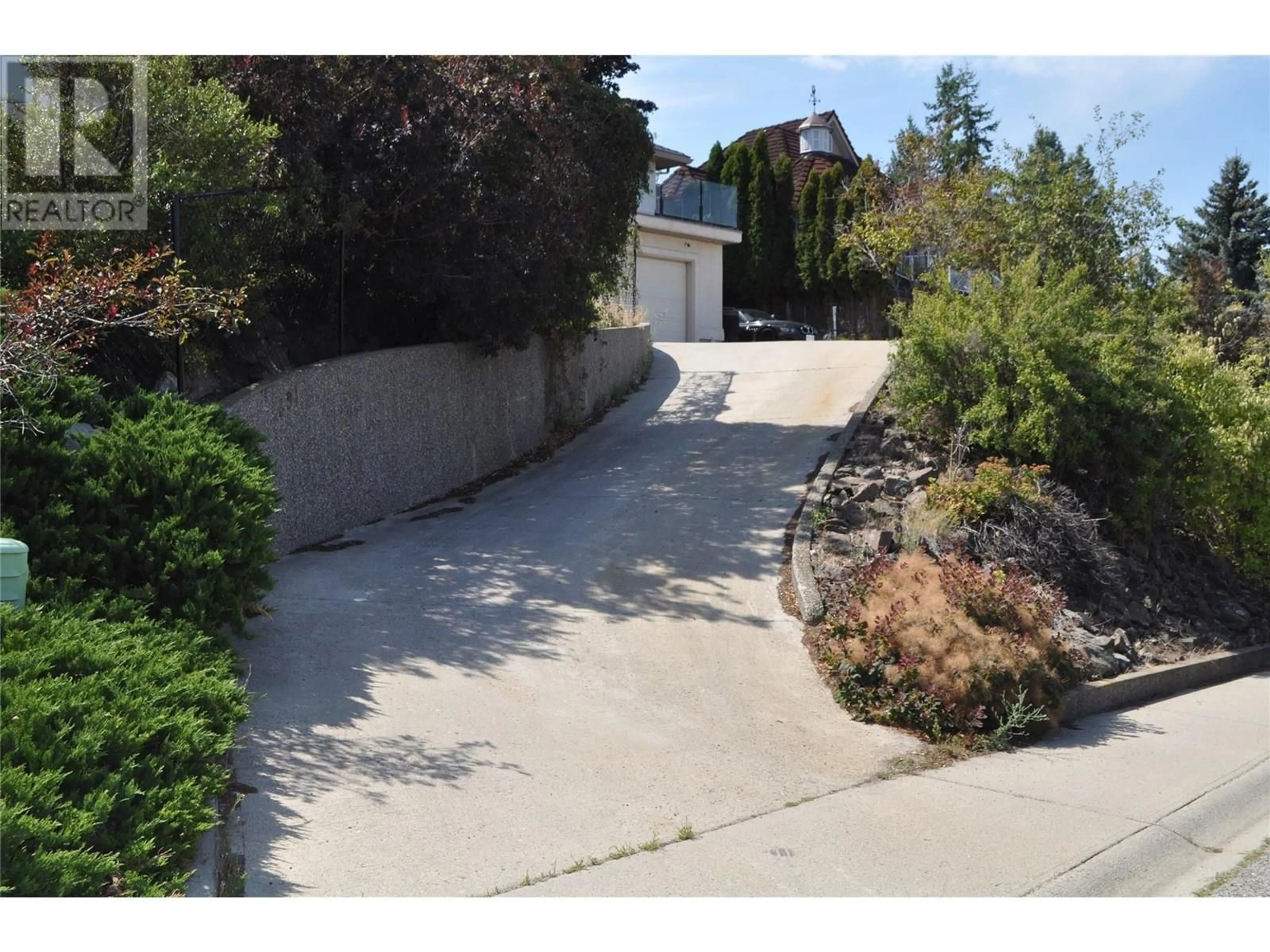 A pic from outside/outdoor area/front of a property/back of a property/a pic from drone, street for 391 STELLAR DRIVE, Kelowna British Columbia V1W4K4