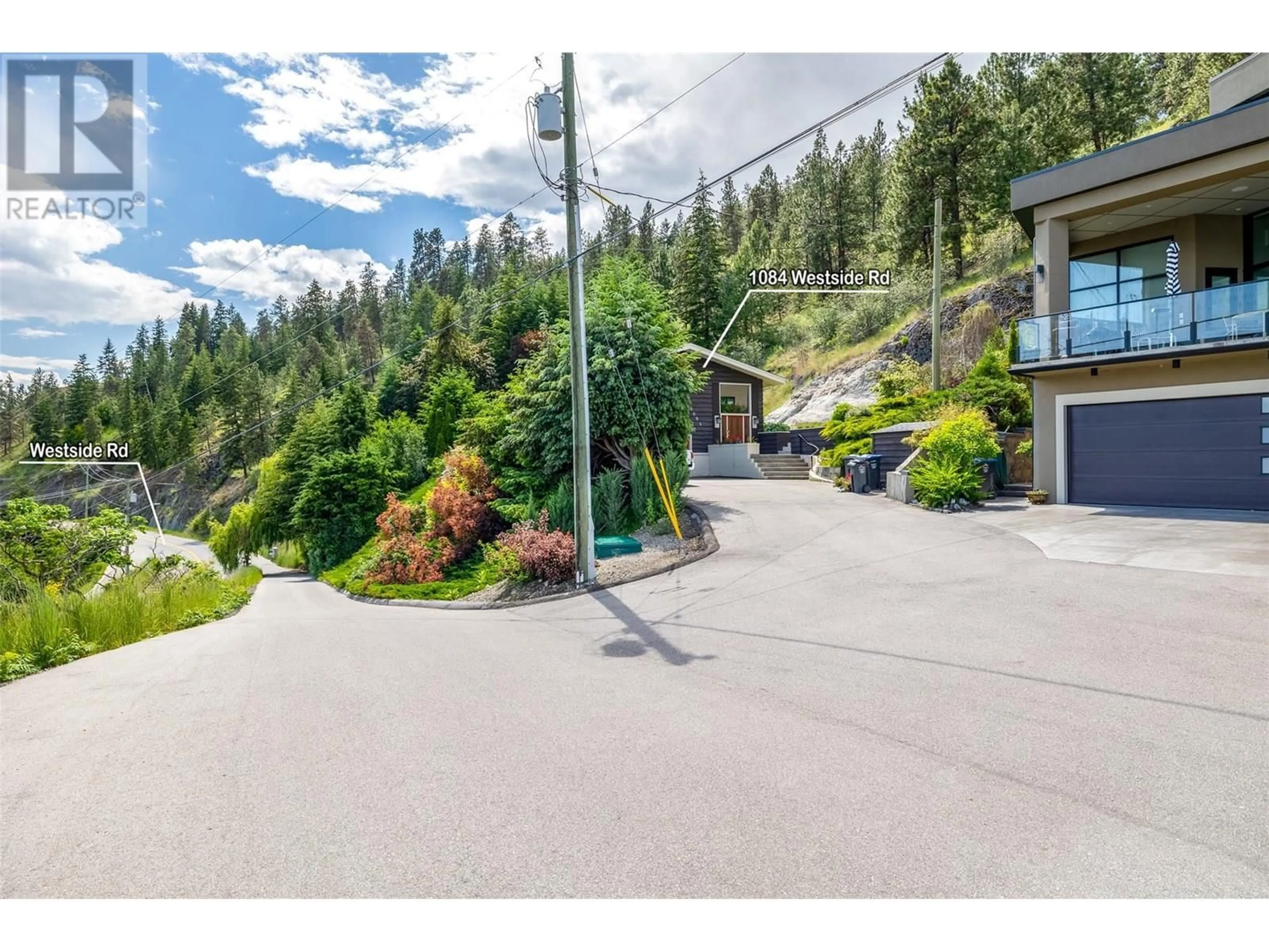 A pic from outside/outdoor area/front of a property/back of a property/a pic from drone, mountain view for 1084 WESTSIDE ROAD SOUTH, West Kelowna British Columbia V1Z3S1