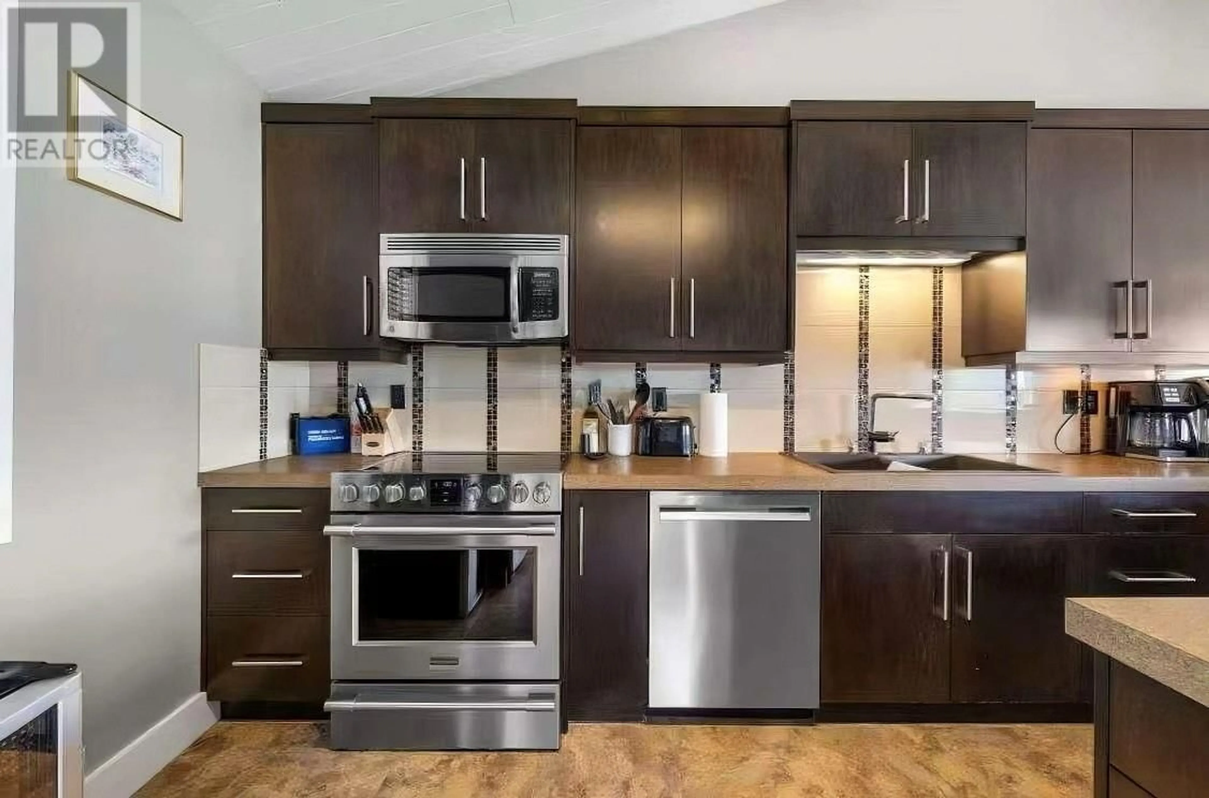 Standard kitchen, wood/laminate floor for 1084 WESTSIDE ROAD SOUTH, West Kelowna British Columbia V1Z3S1