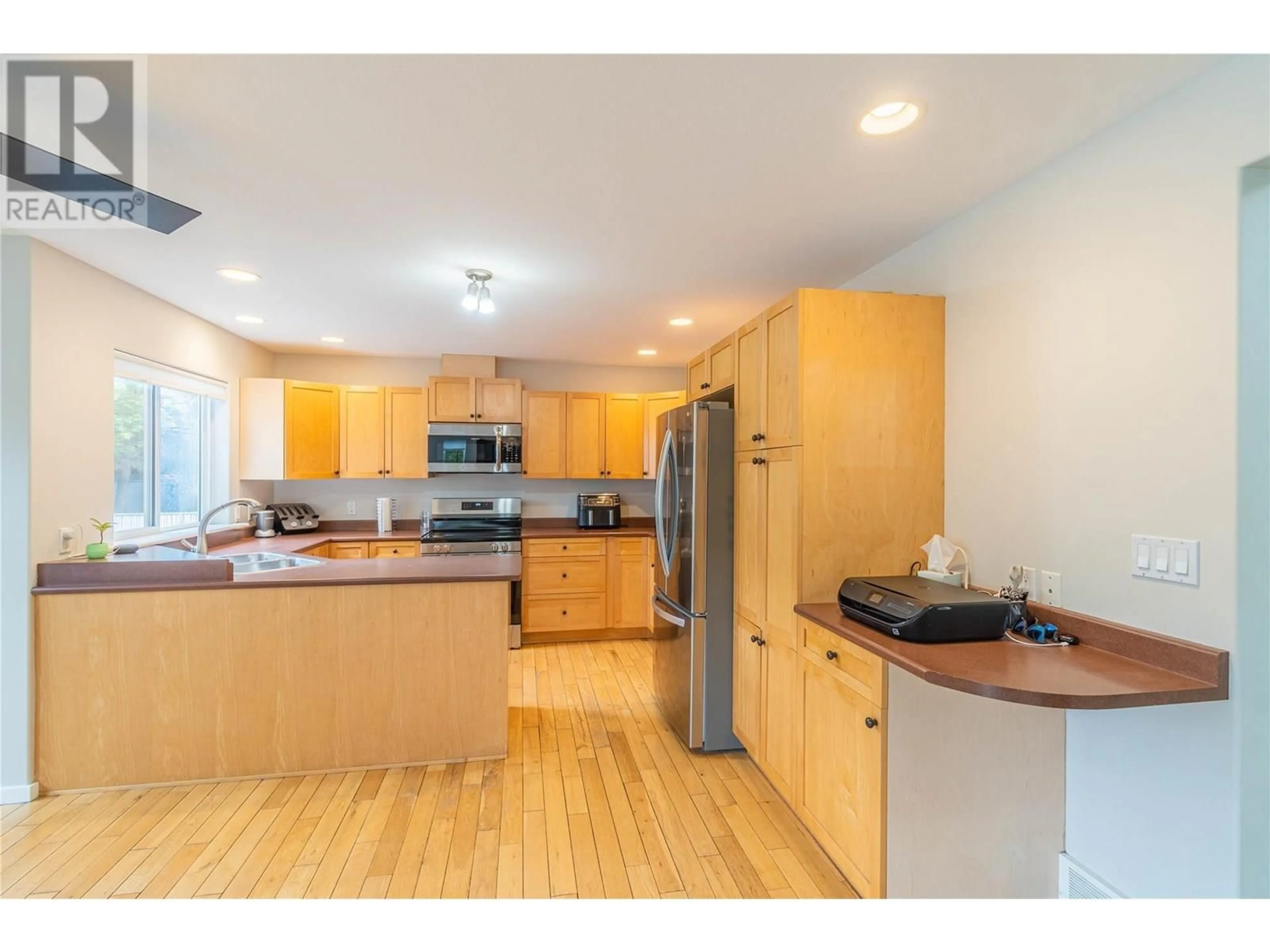 Open concept kitchen, wood/laminate floor for 601 BISSETTE ROAD, Kamloops British Columbia V2B6L3