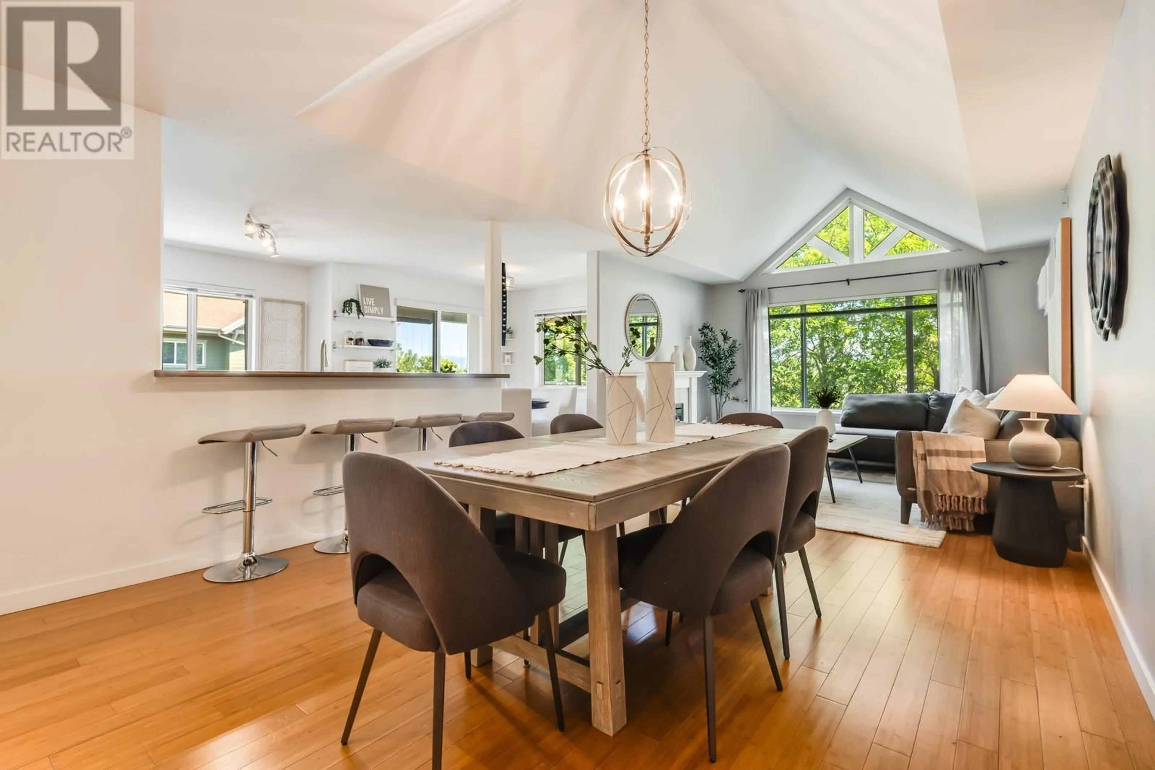 Open concept kitchen, wood/laminate floor for 409 - 686 LEQUIME ROAD, Kelowna British Columbia V1W1A4