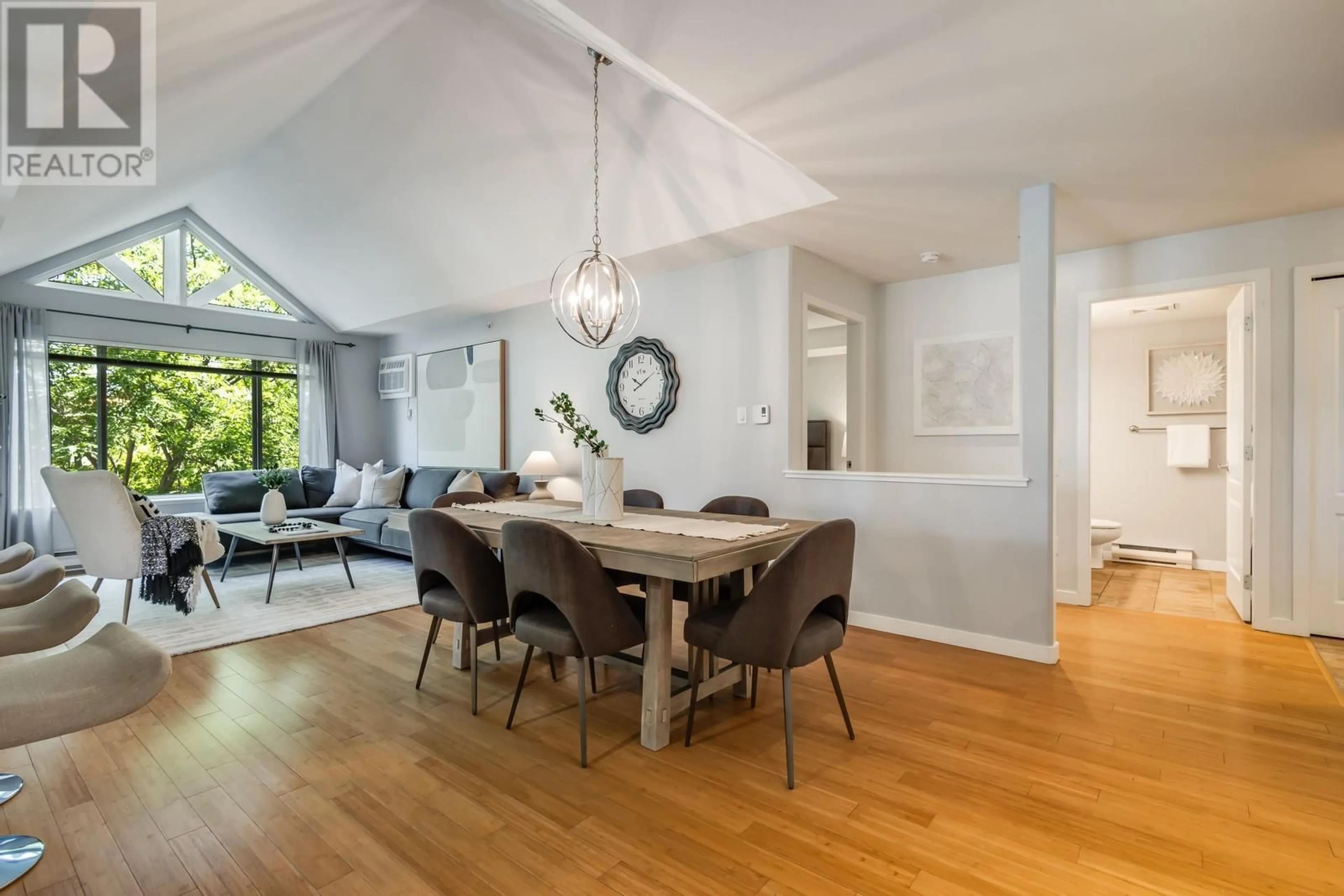 Dining room, wood/laminate floor for 409 - 686 LEQUIME ROAD, Kelowna British Columbia V1W1A4