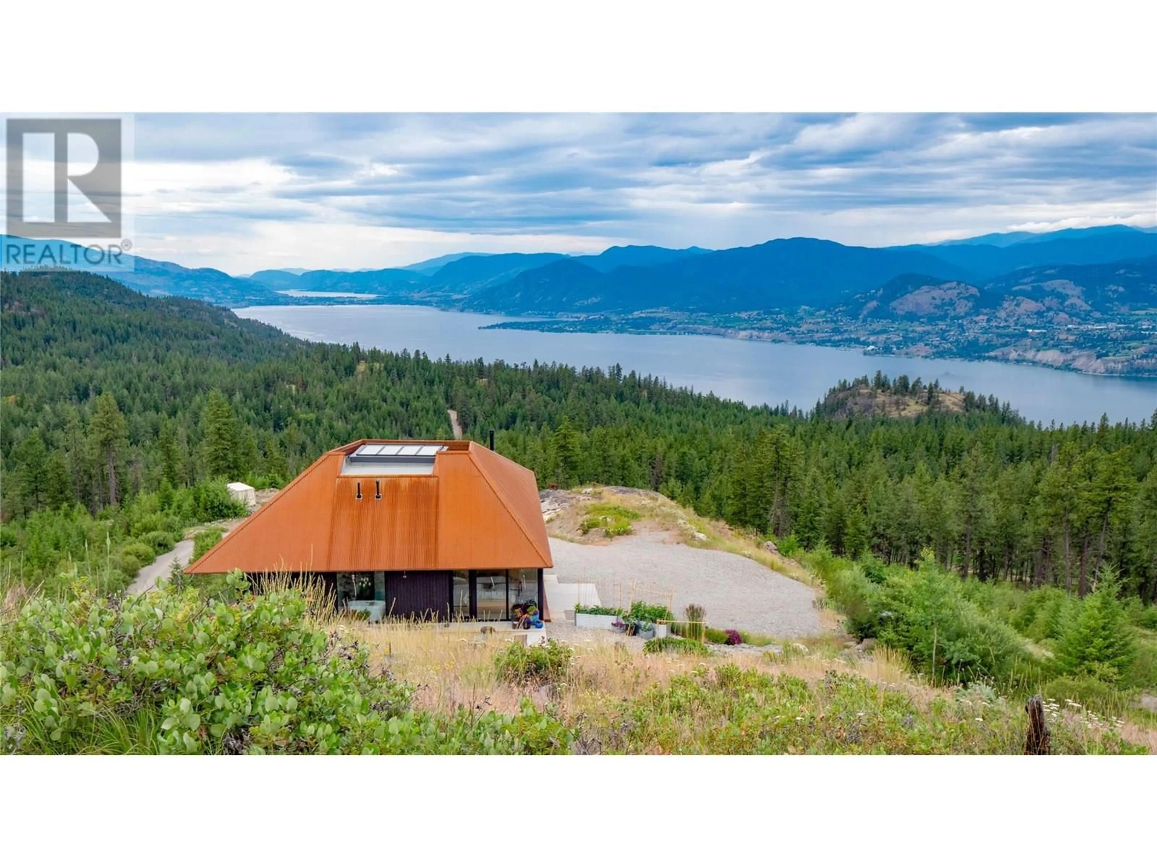A pic from outside/outdoor area/front of a property/back of a property/a pic from drone, mountain view for 7080 GLENFIR ROAD, Naramata British Columbia V0H1N1