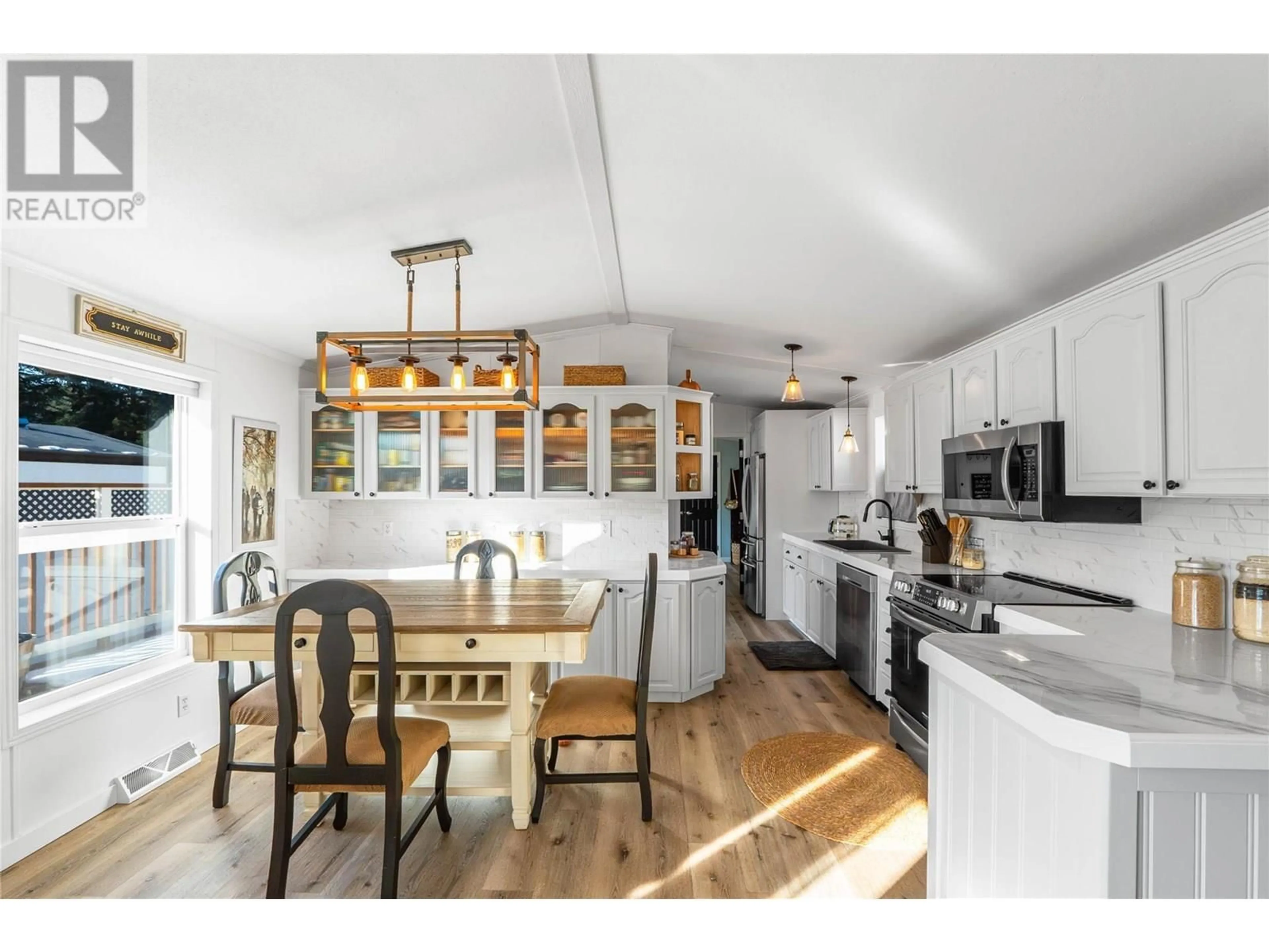 Open concept kitchen, wood/laminate floor for 18 - 5371 PRINCETON AVENUE, Peachland British Columbia V0H1X8