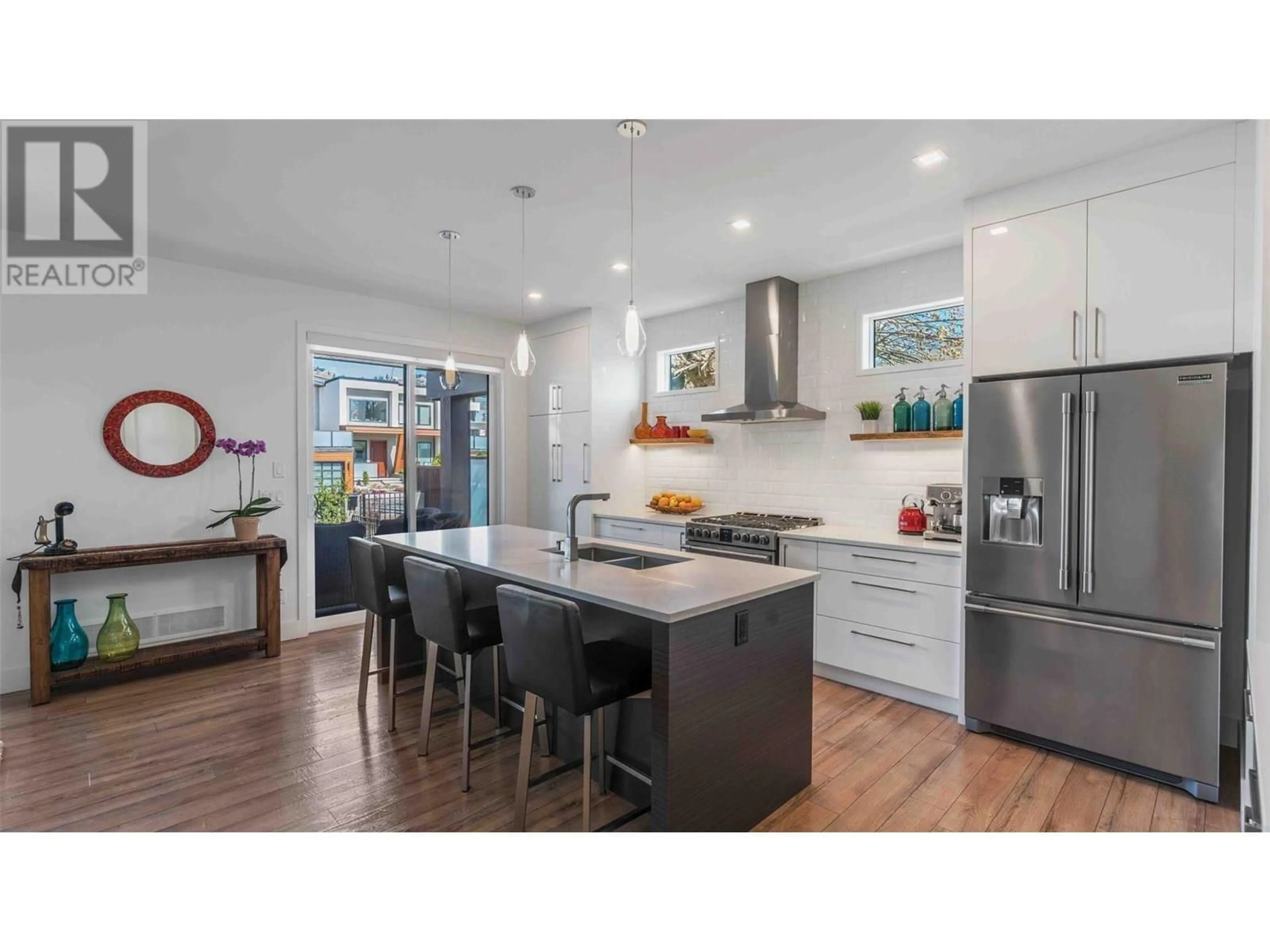 Open concept kitchen, wood/laminate floor for 1027 WILSON AVENUE, Kelowna British Columbia V1Y6Y4
