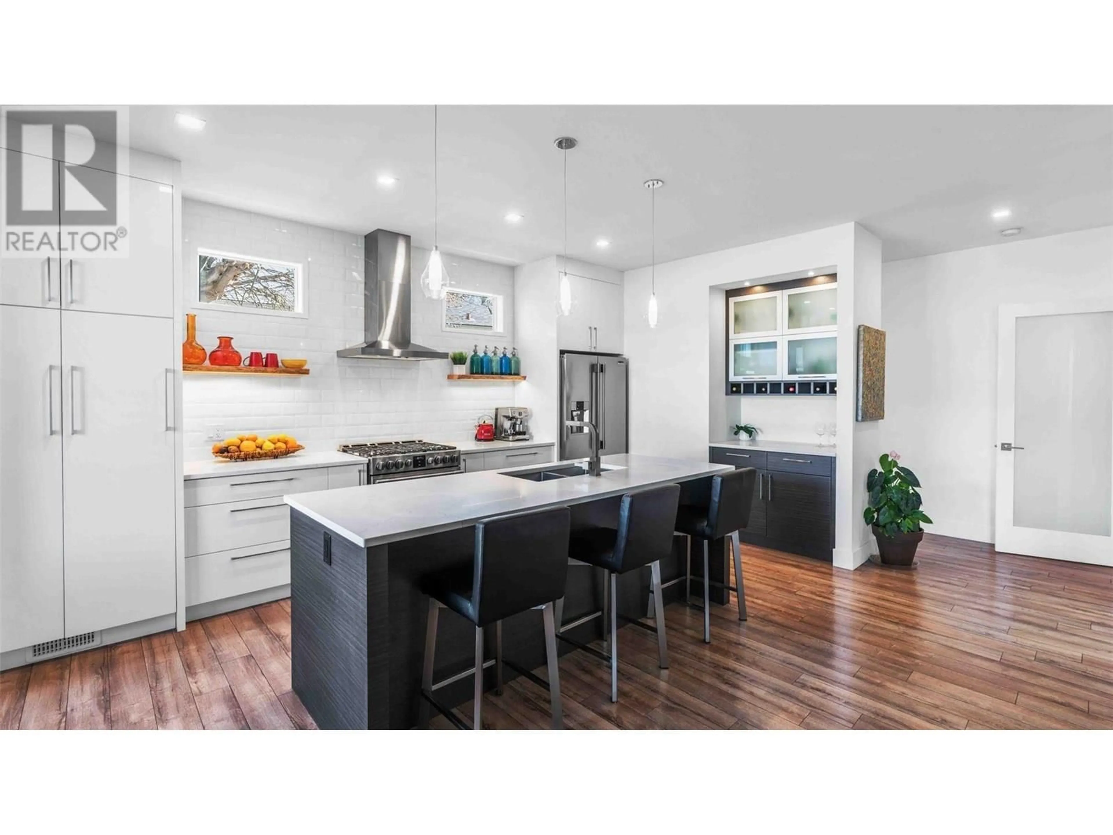Contemporary kitchen, wood/laminate floor for 1027 WILSON AVENUE, Kelowna British Columbia V1Y6Y4
