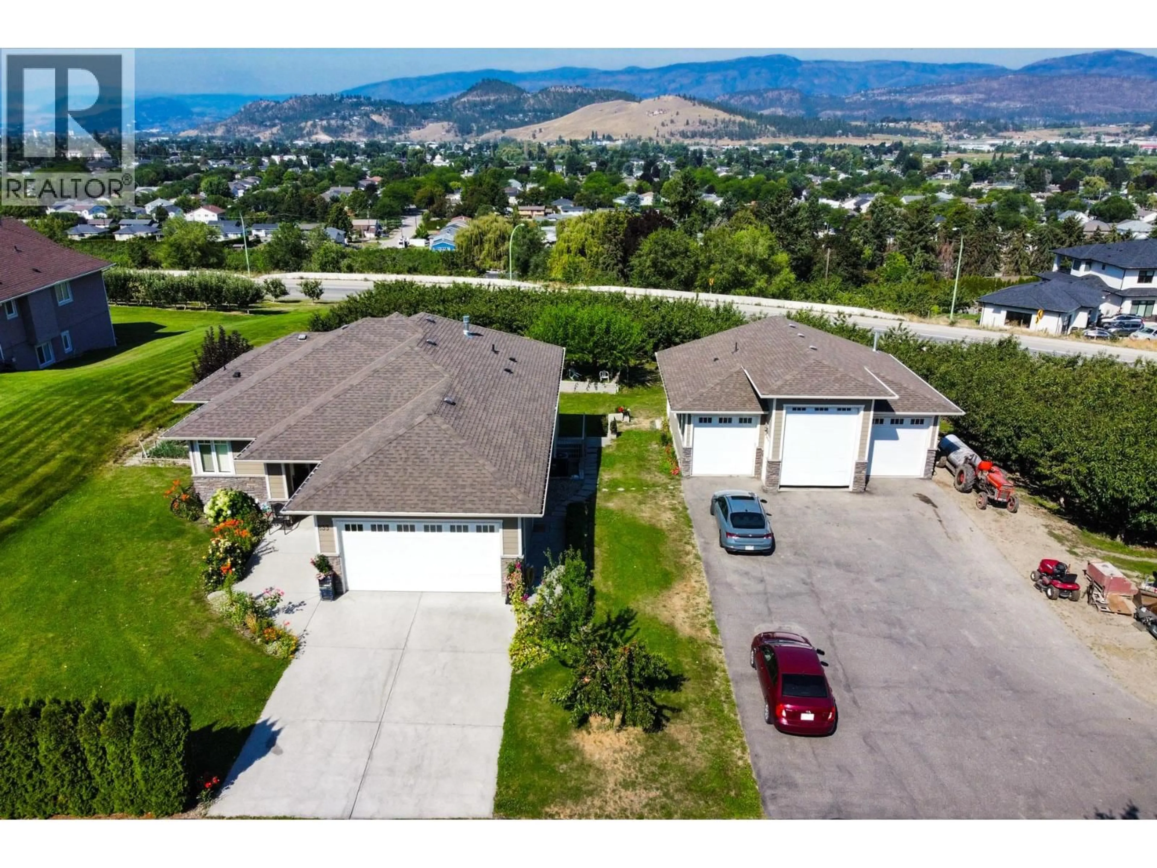 A pic from outside/outdoor area/front of a property/back of a property/a pic from drone, mountain view for 833 MCCURDY ROAD EAST, Kelowna British Columbia V1X8G3