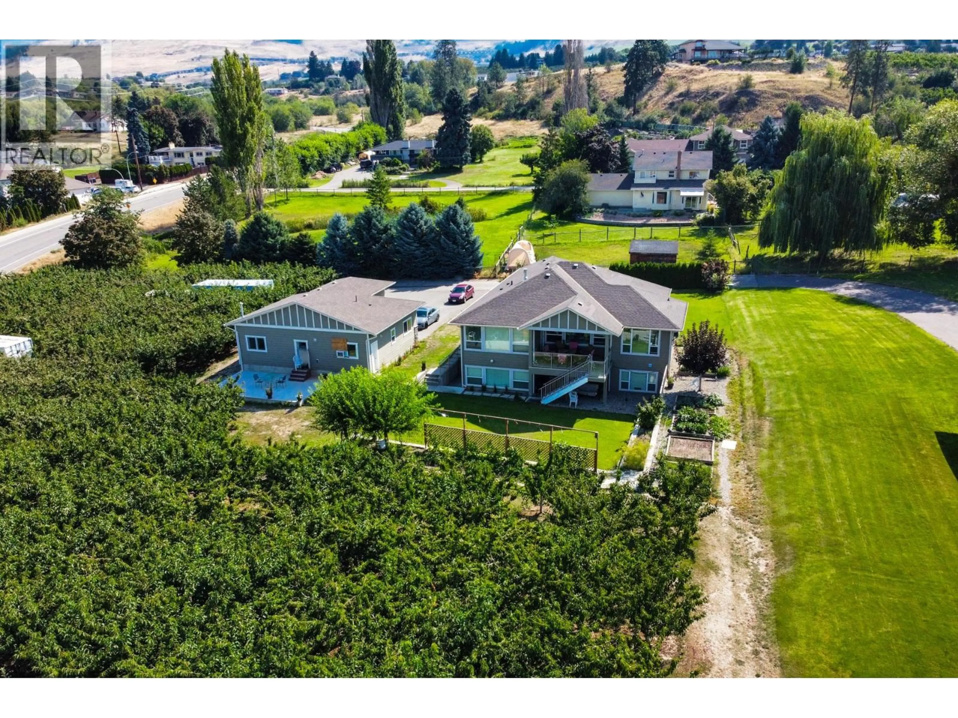A pic from outside/outdoor area/front of a property/back of a property/a pic from drone, water/lake/river/ocean view for 833 MCCURDY ROAD EAST, Kelowna British Columbia V1X8G3