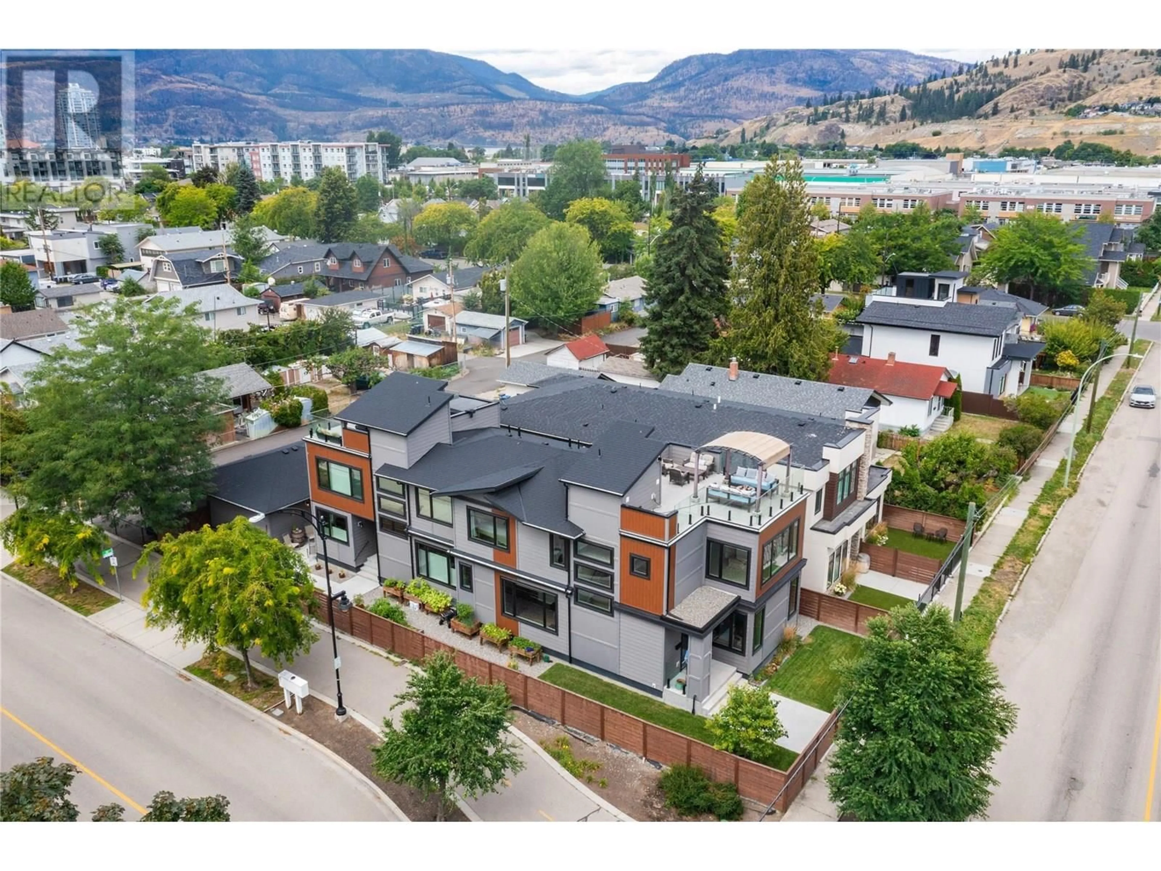 A pic from outside/outdoor area/front of a property/back of a property/a pic from drone, mountain view for 1292 ETHEL STREET, Kelowna British Columbia V1Y2W7