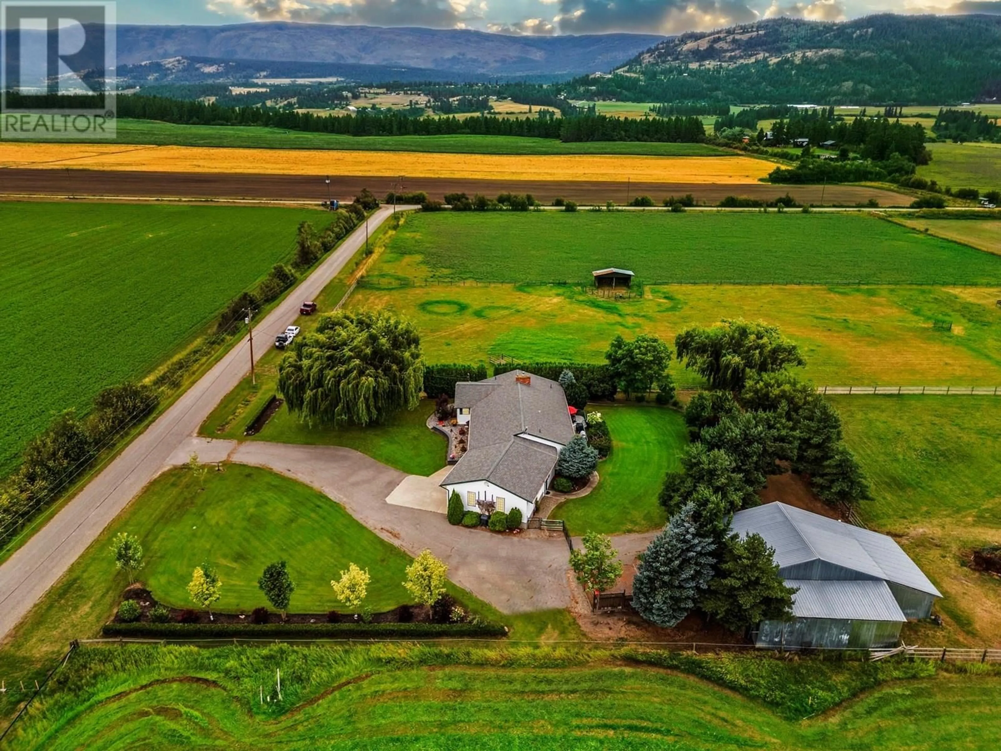 A pic from outside/outdoor area/front of a property/back of a property/a pic from drone, mountain view for 1176 THOMAS HAYES ROAD, Armstrong British Columbia V0E1B6