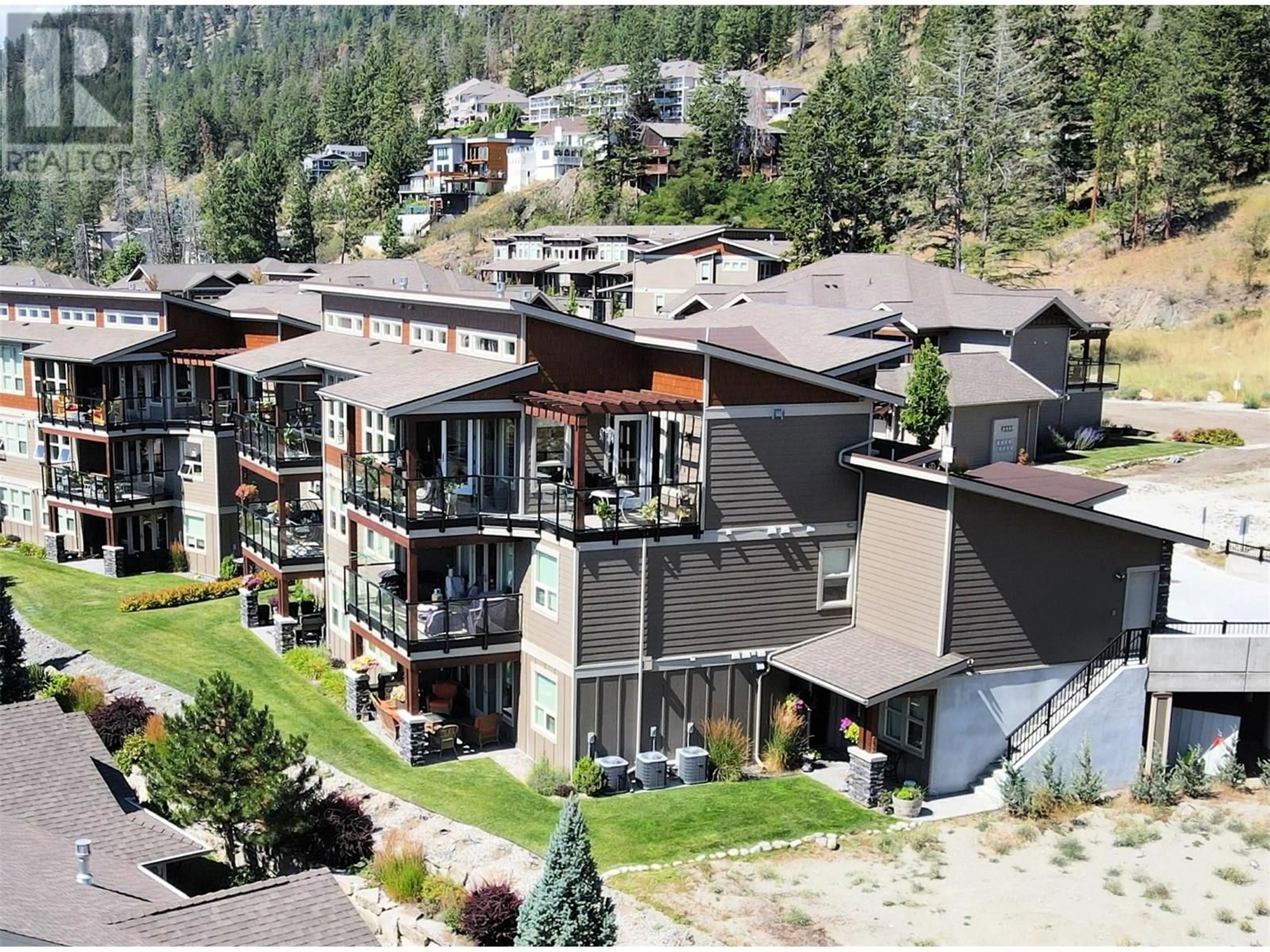 A pic from outside/outdoor area/front of a property/back of a property/a pic from drone, unknown for 228 - 4000 REDSTONE CRESCENT, Peachland British Columbia V0H1X5