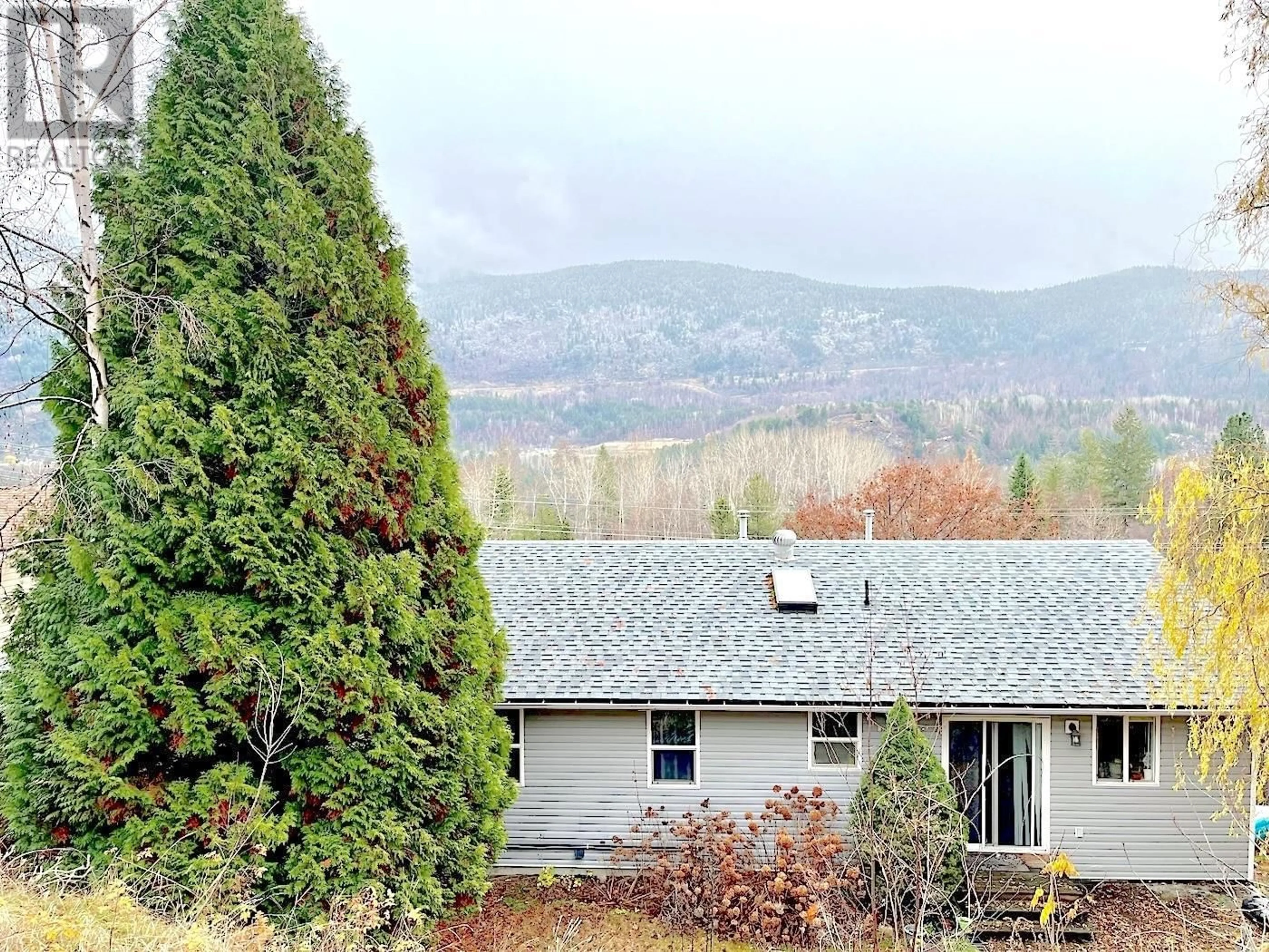 A pic from outside/outdoor area/front of a property/back of a property/a pic from drone, mountain view for 3703 9TH AVENUE, Castlegar British Columbia N1N3T3