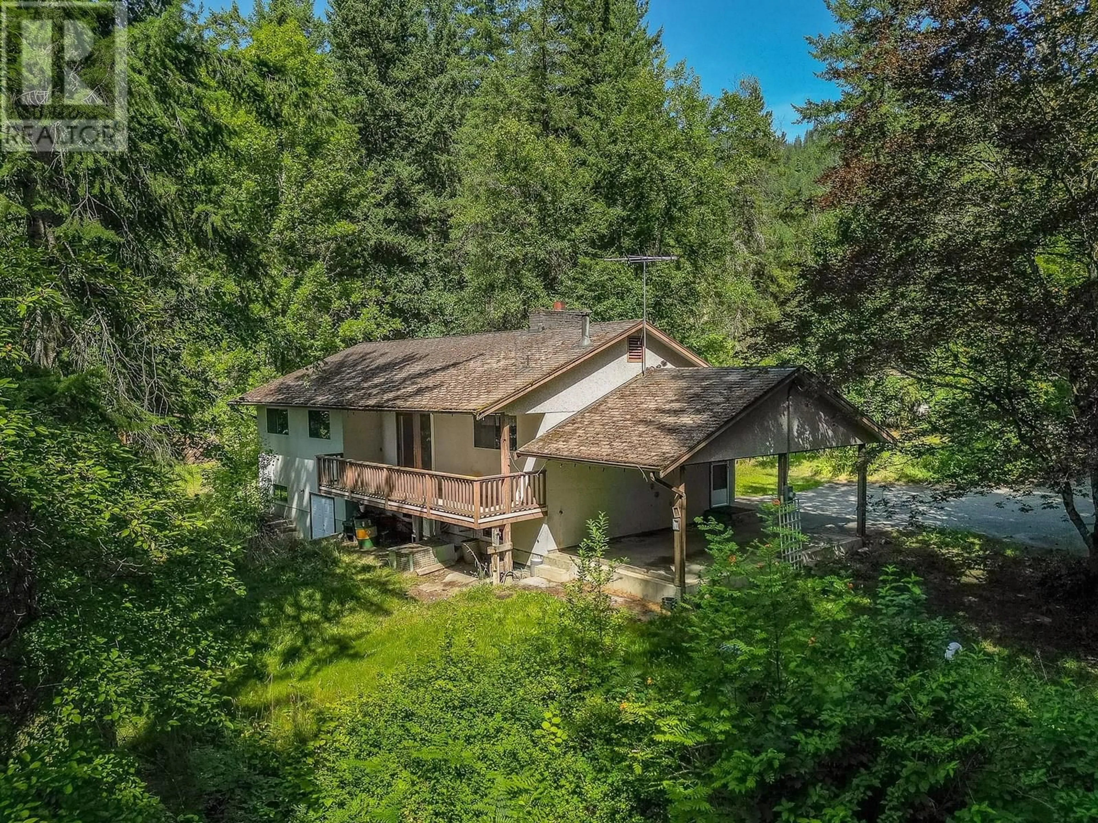 A pic from outside/outdoor area/front of a property/back of a property/a pic from drone, forest/trees view for 1926 BUNDUS ROAD, Sicamous British Columbia V0E2V5