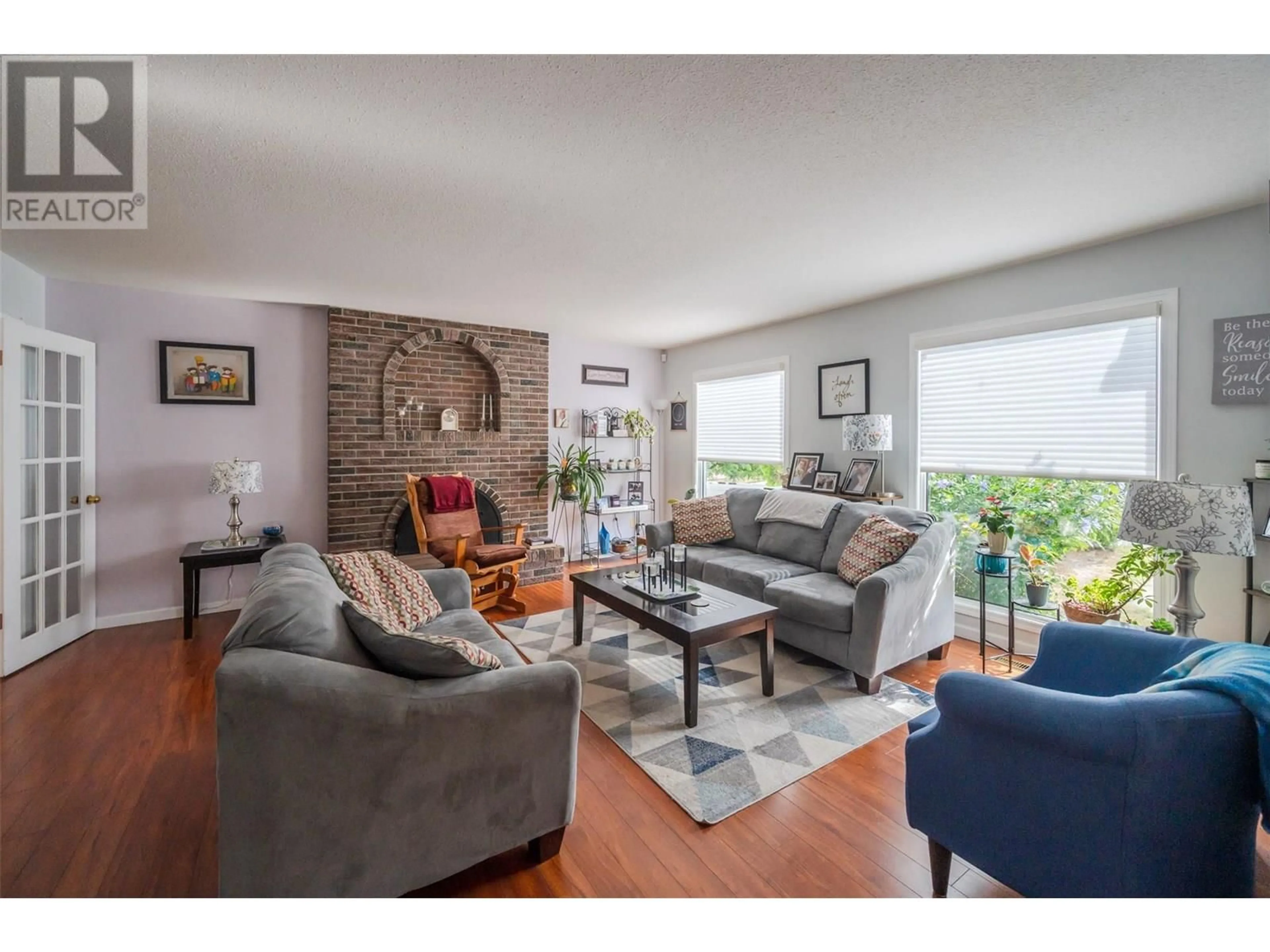 Living room with furniture, wood/laminate floor for 601 ALDER STREET, Penticton British Columbia V2A4C5