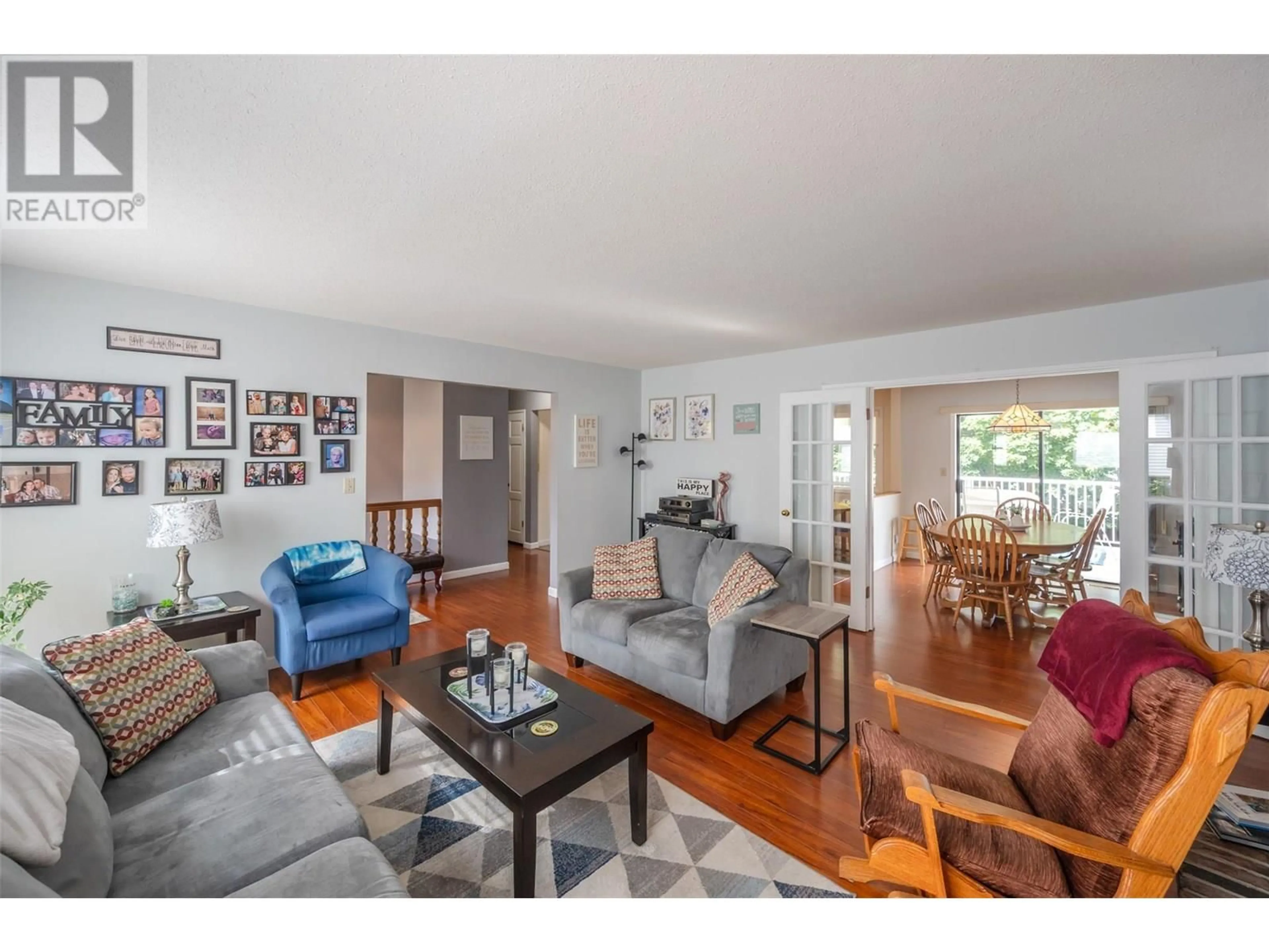 Living room with furniture, wood/laminate floor for 601 ALDER STREET, Penticton British Columbia V2A4C5