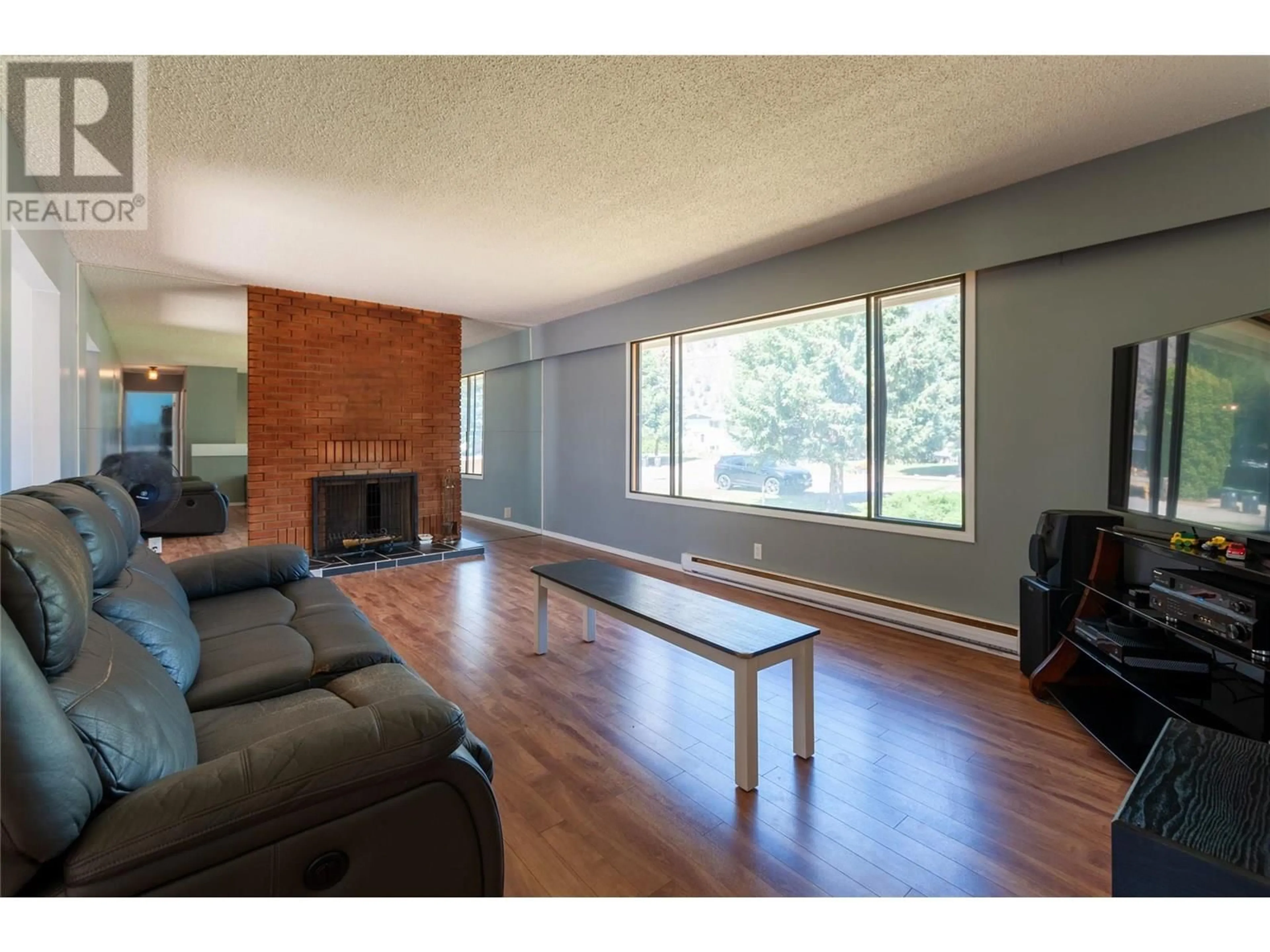 Living room with furniture, wood/laminate floor for 415 3RD AVENUE, Keremeos British Columbia V0X1N2