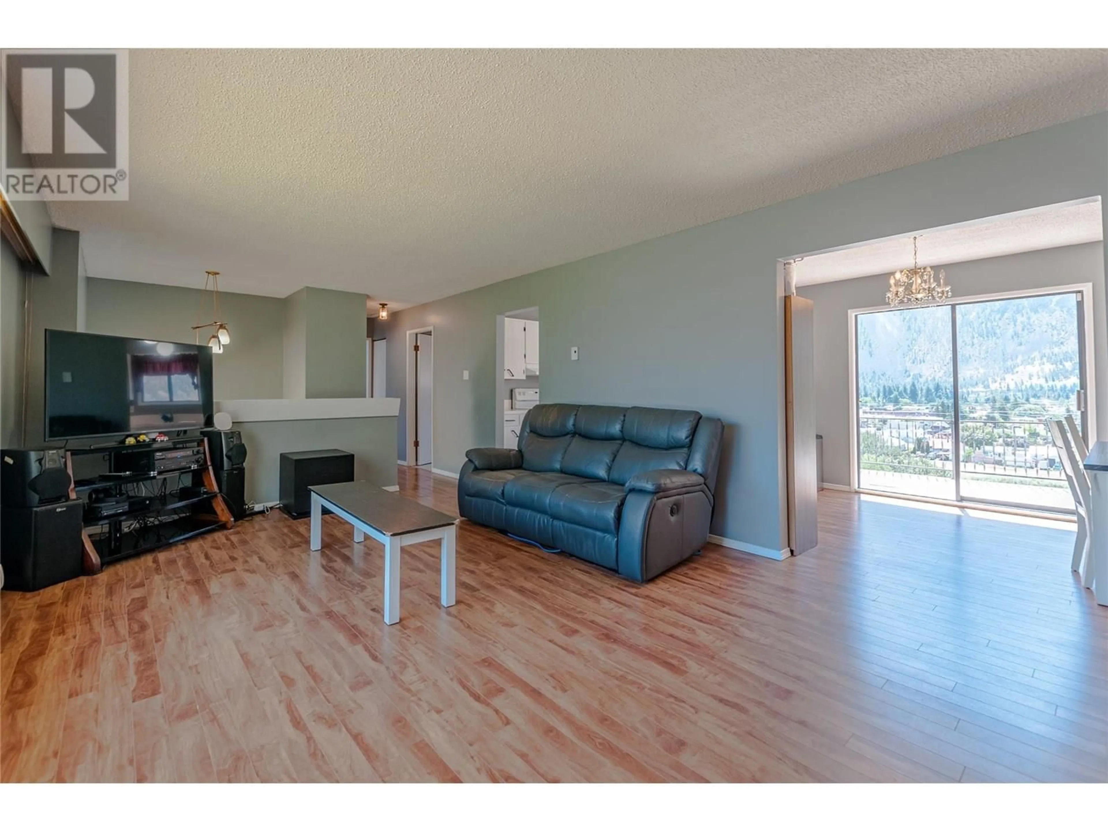 Living room with furniture, wood/laminate floor for 415 3RD AVENUE, Keremeos British Columbia V0X1N2