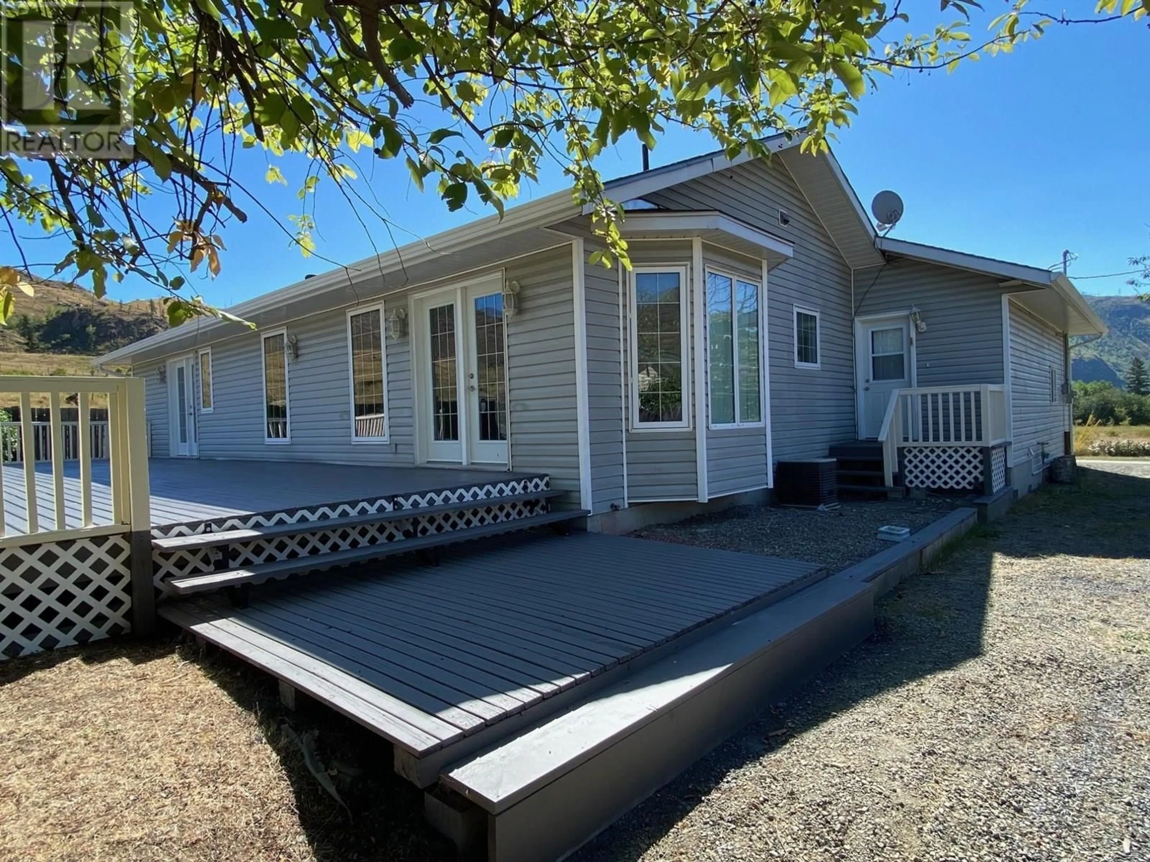 Home with vinyl exterior material, street for 709 STONE ROAD, Barriere British Columbia V0E2E0