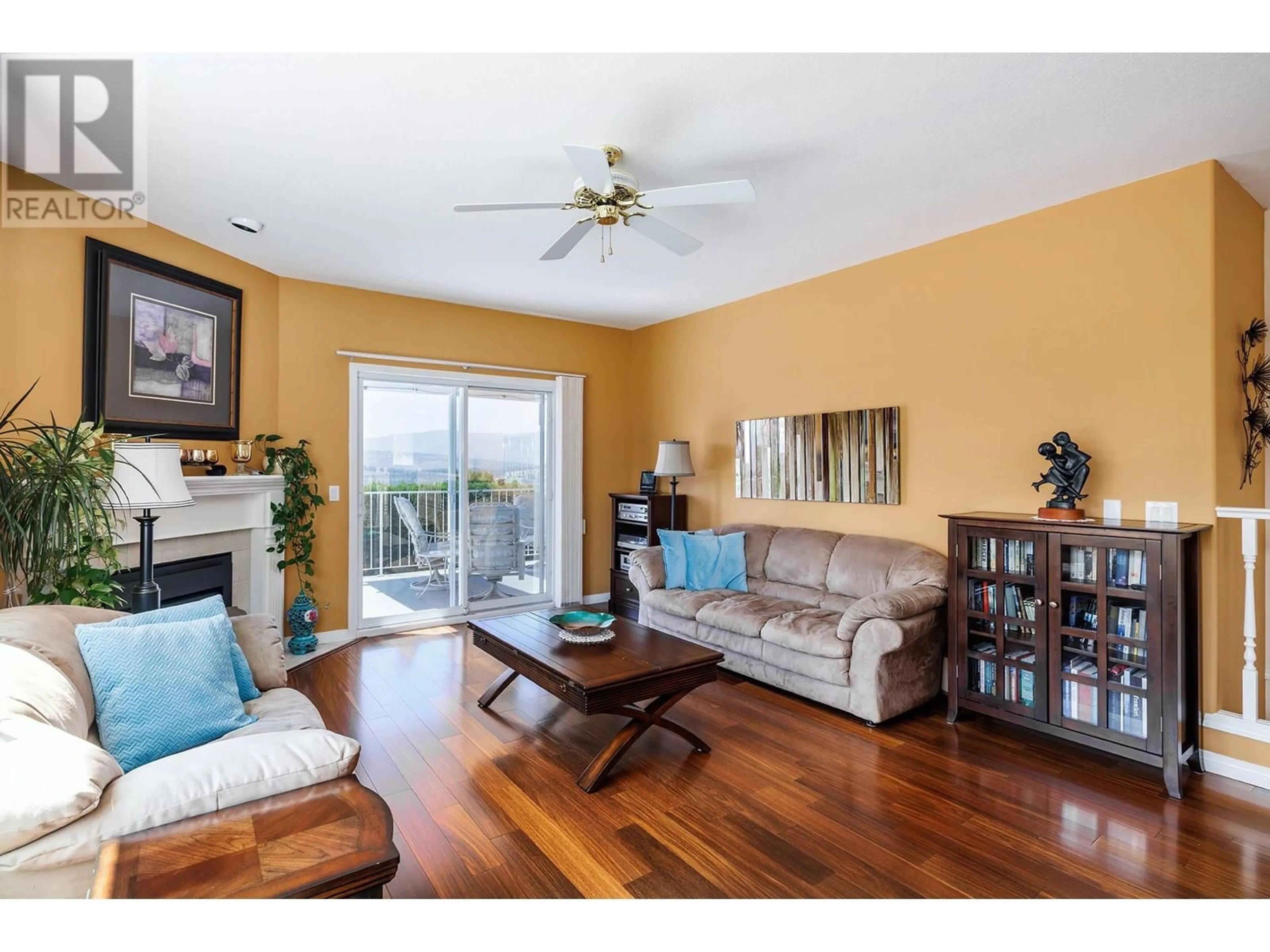 Living room with furniture, wood/laminate floor for 71 - 6400 SPENCER ROAD, Ellison British Columbia V1X7T6