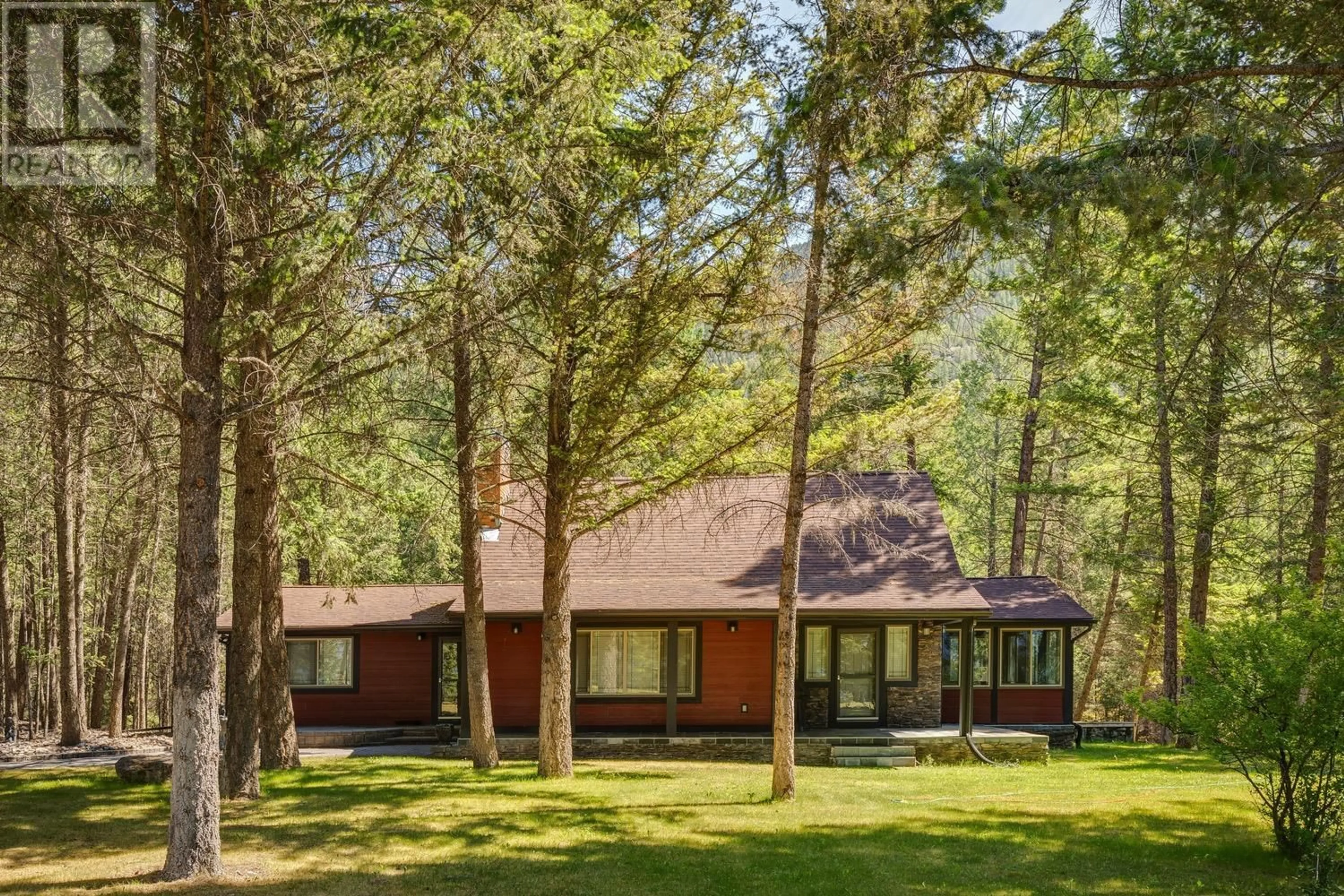 Home with vinyl exterior material, forest/trees view for 8566 EACRETT ROAD, Dry Gulch British Columbia V0A1K2