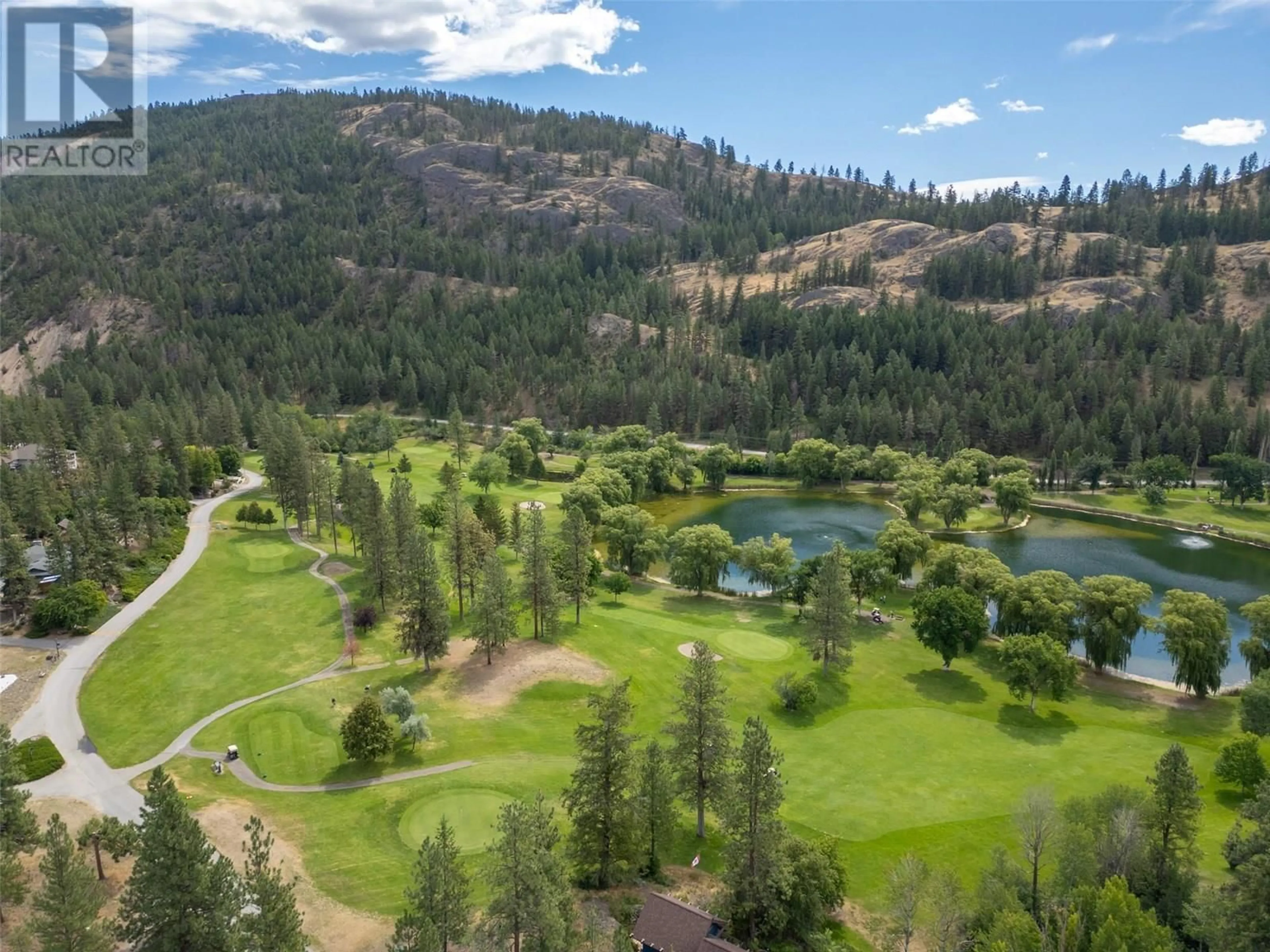 A pic from outside/outdoor area/front of a property/back of a property/a pic from drone, forest/trees view for 104 SAND DRIVE, Kaleden British Columbia V0H1K0