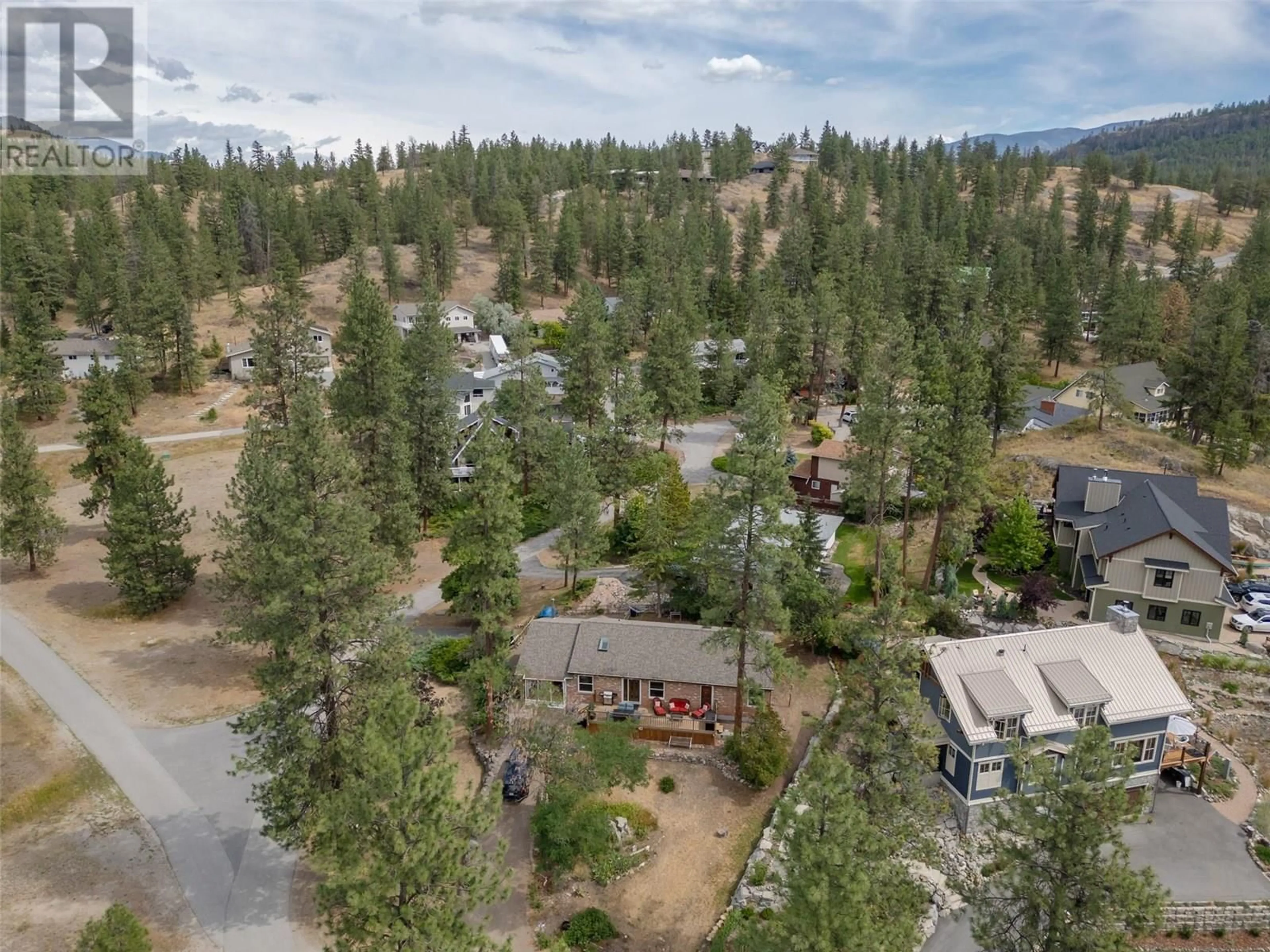 A pic from outside/outdoor area/front of a property/back of a property/a pic from drone, forest/trees view for 104 SAND DRIVE, Kaleden British Columbia V0H1K0