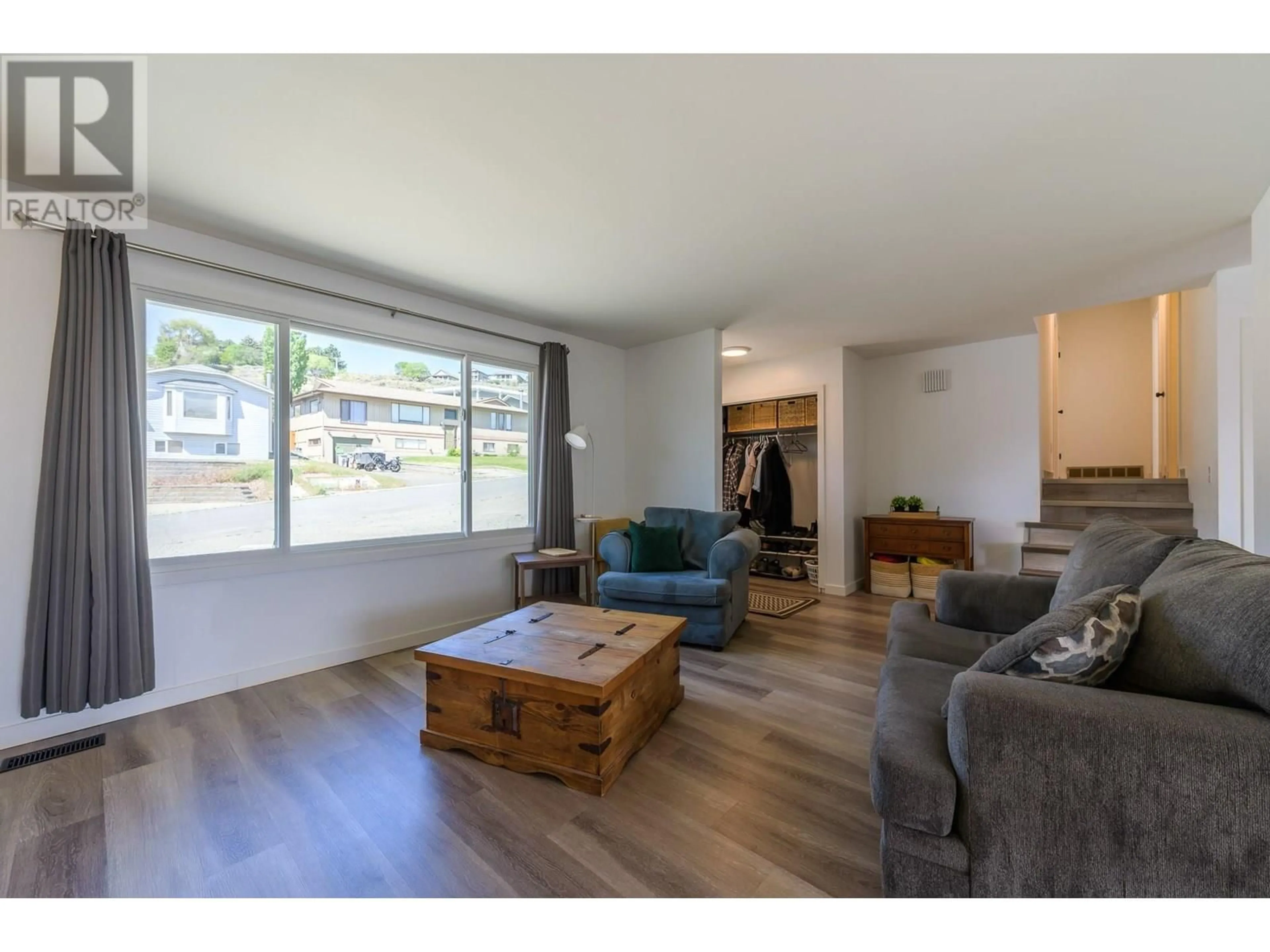 Living room with furniture, wood/laminate floor for 1737 PENNASK TERRACE, Kamloops British Columbia V2B7N9