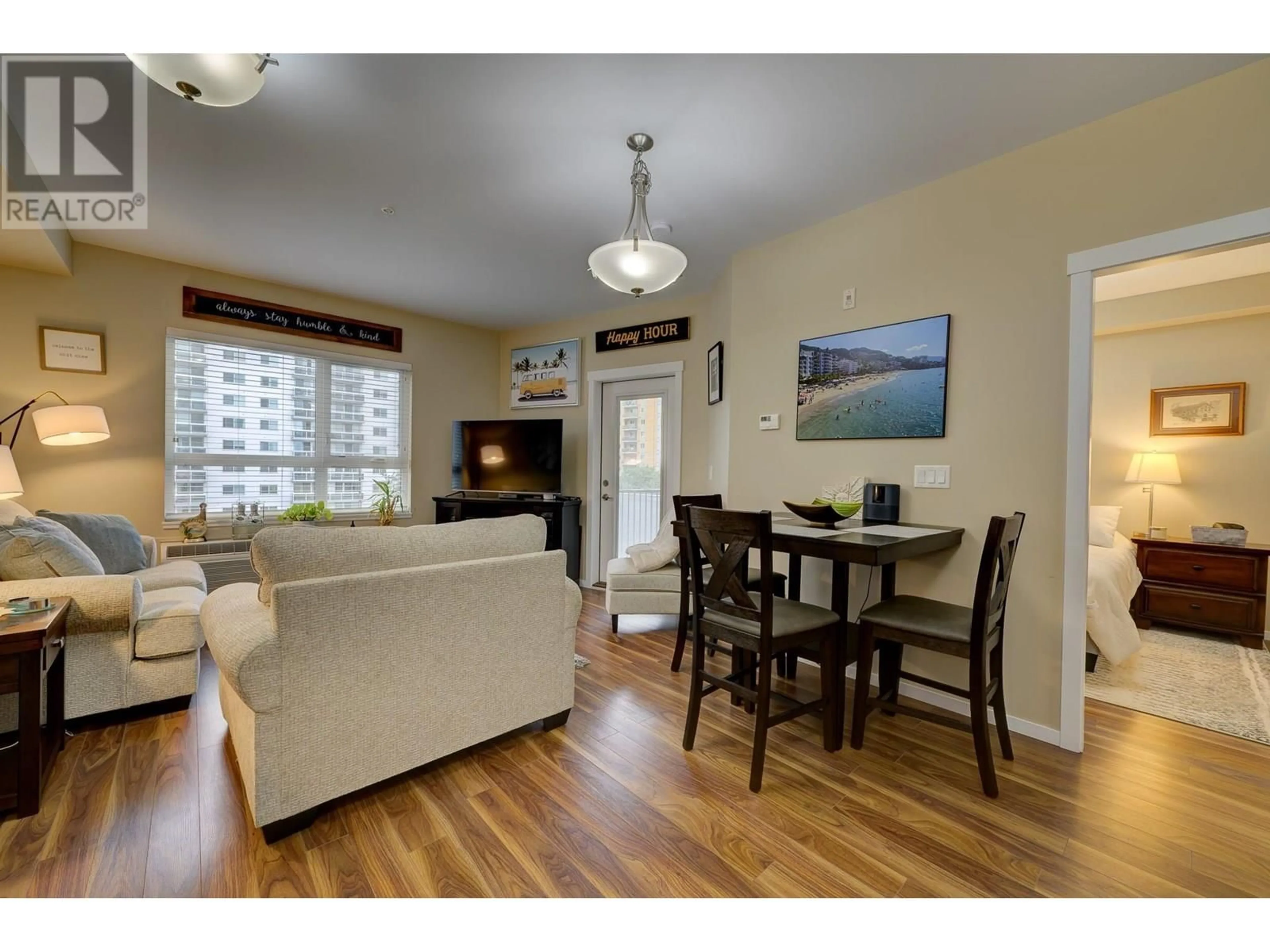 Living room with furniture, wood/laminate floor for 509 - 429 ST PAUL STREET, Kamloops British Columbia V2C2J7
