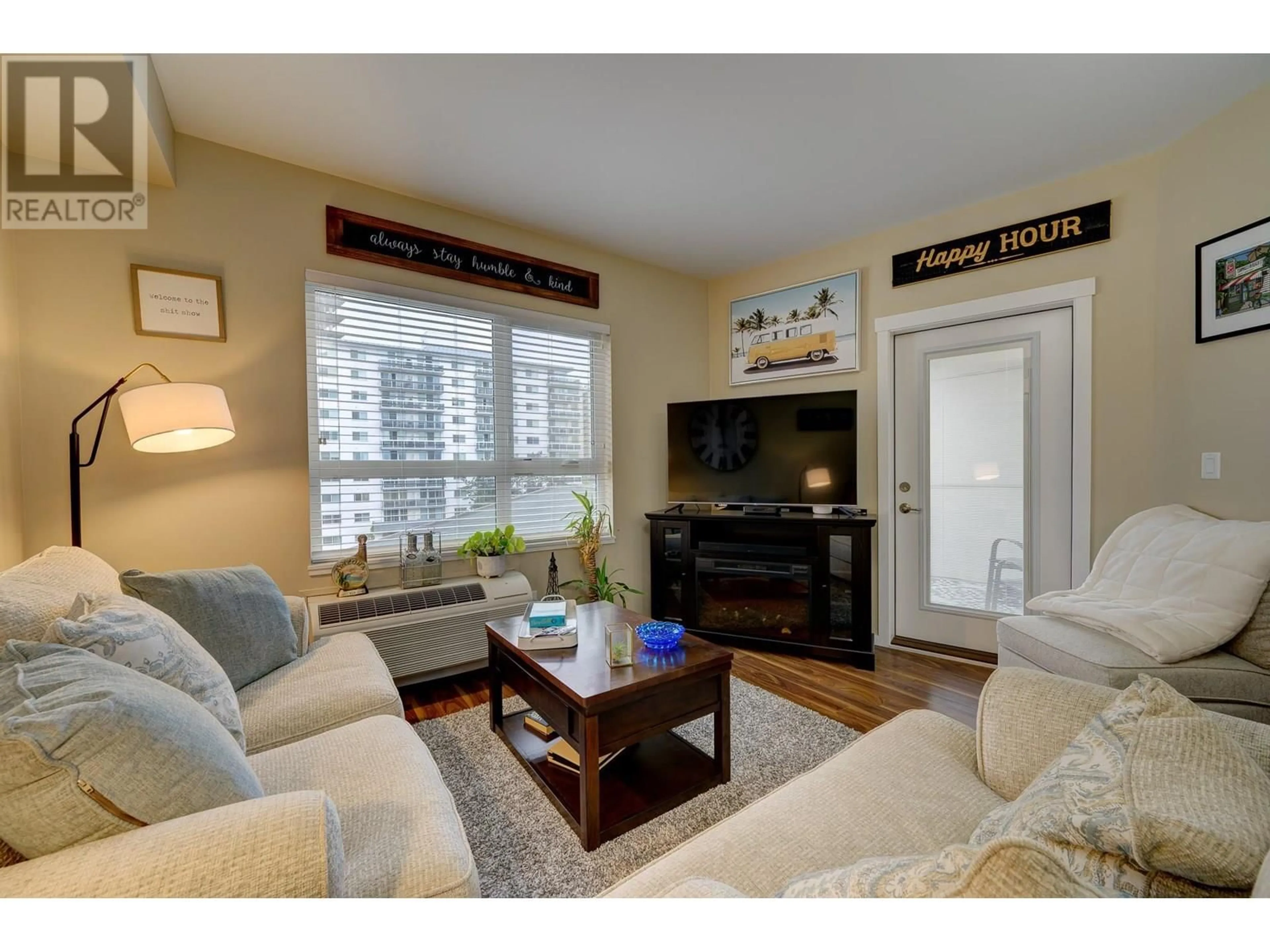 Living room with furniture, wood/laminate floor for 509 - 429 ST PAUL STREET, Kamloops British Columbia V2C2J7